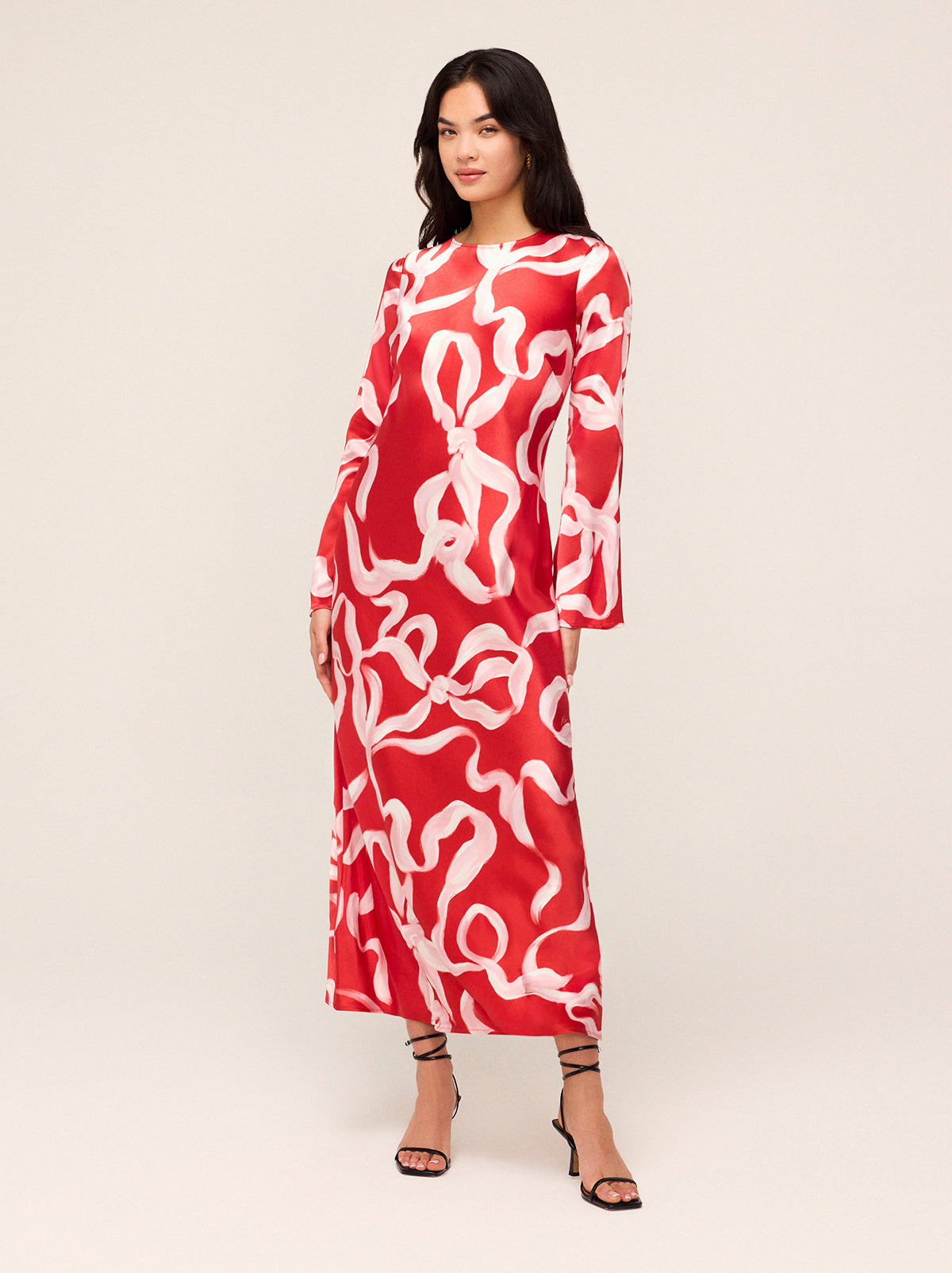 Keira Red Ribbon Print Maxi Dress - Keira is a bias-cut maxi dress with flared sleeves and a scoop neck. Her ballet-inspired ribbon print in KITRI favourite red and pink will live on in your wardrobe season after season. She looks great with heels and knee-high boots.