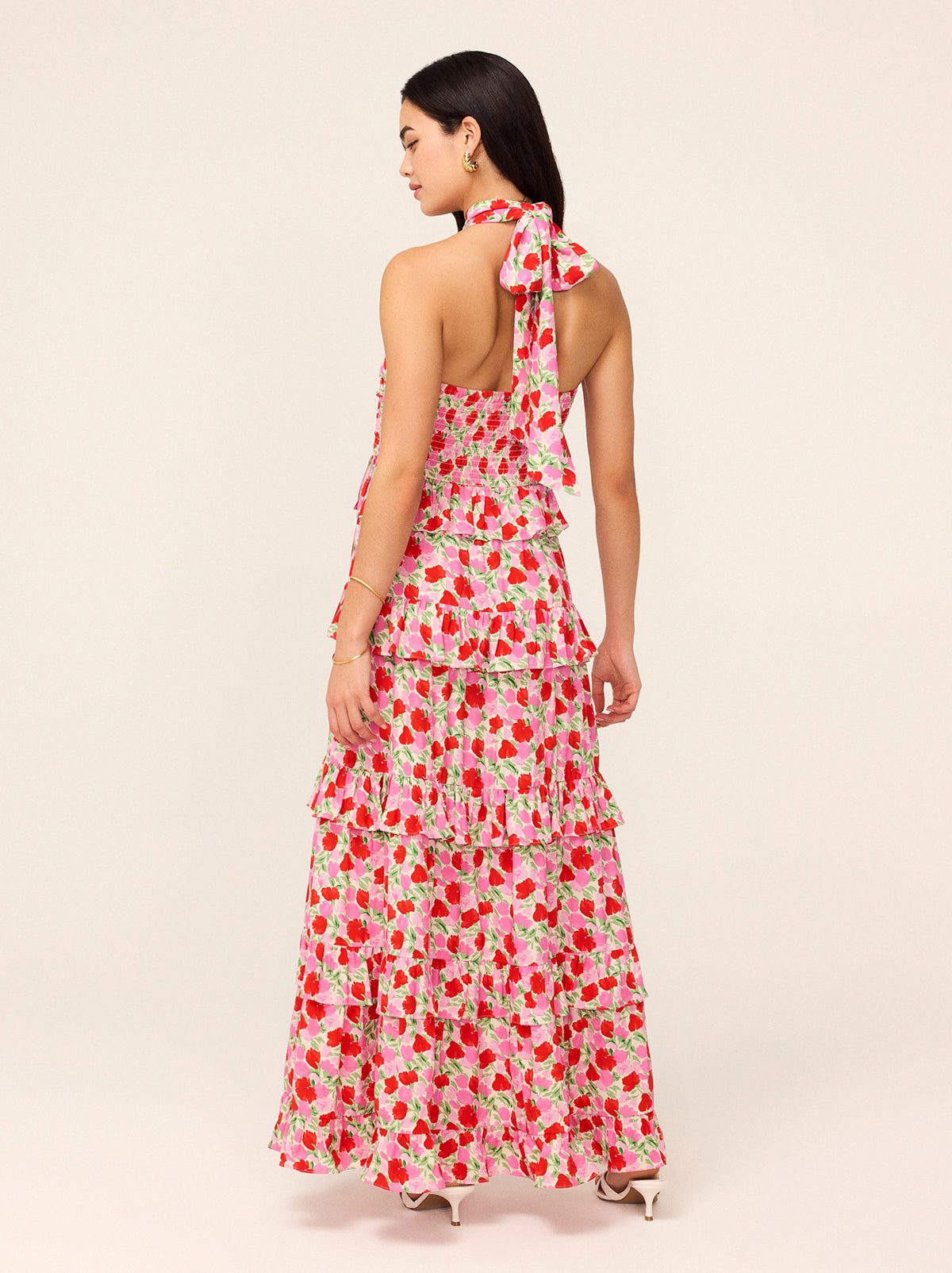 Romily Pink Floral Print Maxi Dress by Kitri Studio. The Romily Dress is here to make a statement.  Designed for effortless elegance, this maxi gown features a flattering crossover neckline and a softly pleated bodice, creating a dreamy, feminine silhouette. Halter neckline. Concealed side-zip. Lined Bodice. 59%% Lenzing™ Ecovero™  Viscose 41%% Viscose.