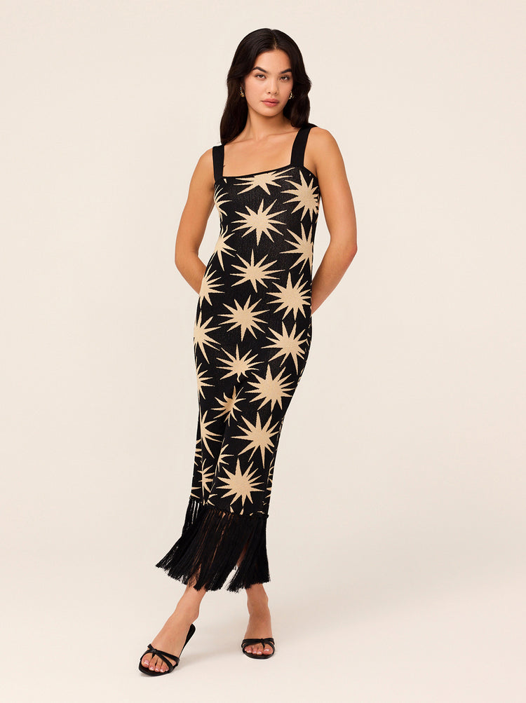 Talitha Black Star Lurex Knit Dress - Talitha is a flattering and figure-hugging lurex knit, her wide straps are bra-friendly and her hem fringing adds some drama. Not to mention the golden stars woven through for added shimmer. 