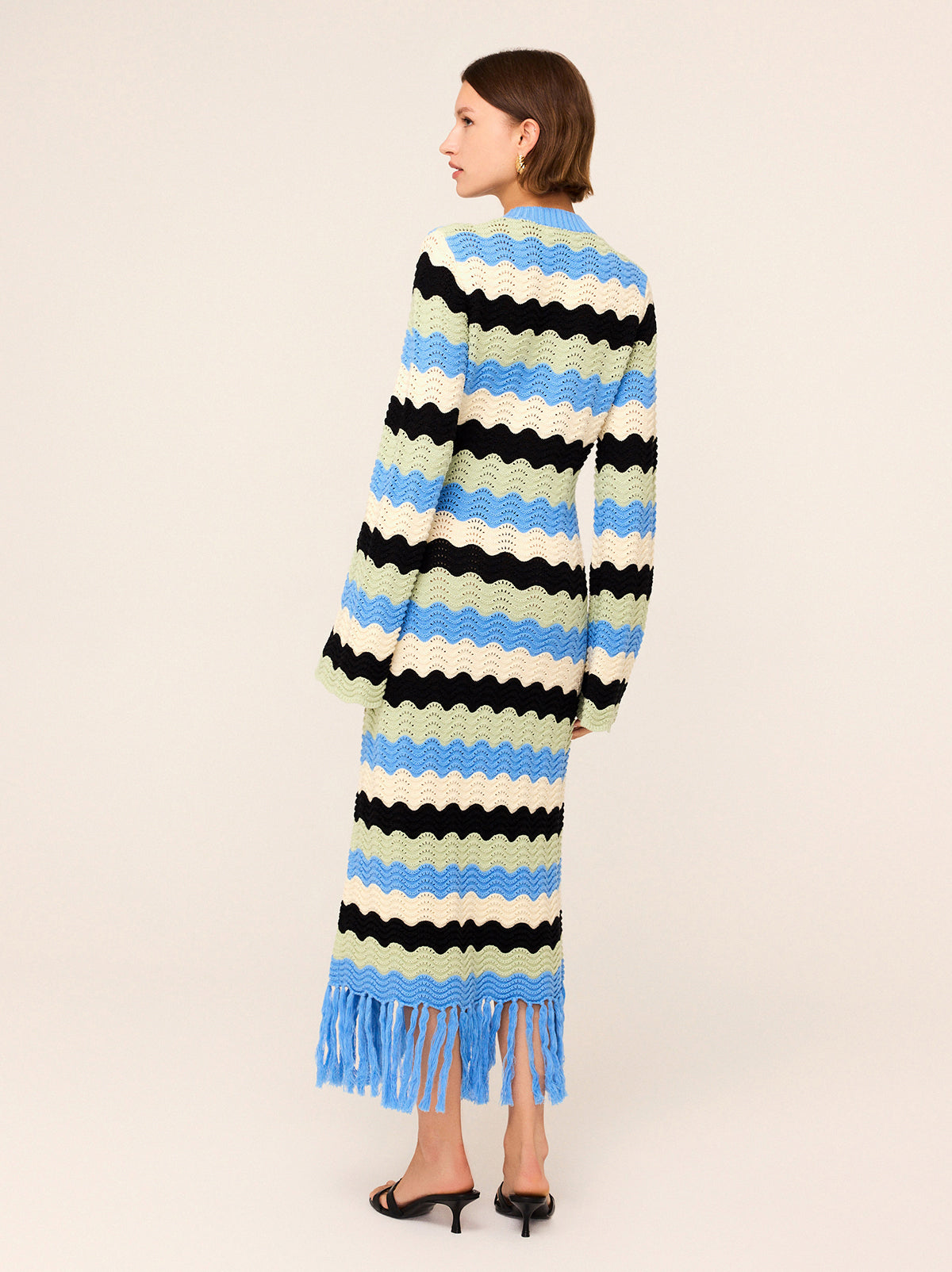 Ondine Blue Multi Crochet Knit Dress by Kitri Studio. Crochet dream.  Ondine is our latest crochet midi dress made for transitional weather in compact cotton and viscose blend yarn. Round neck. Long sleeves. Slim fit . 60% Cotton, 40% Viscose .