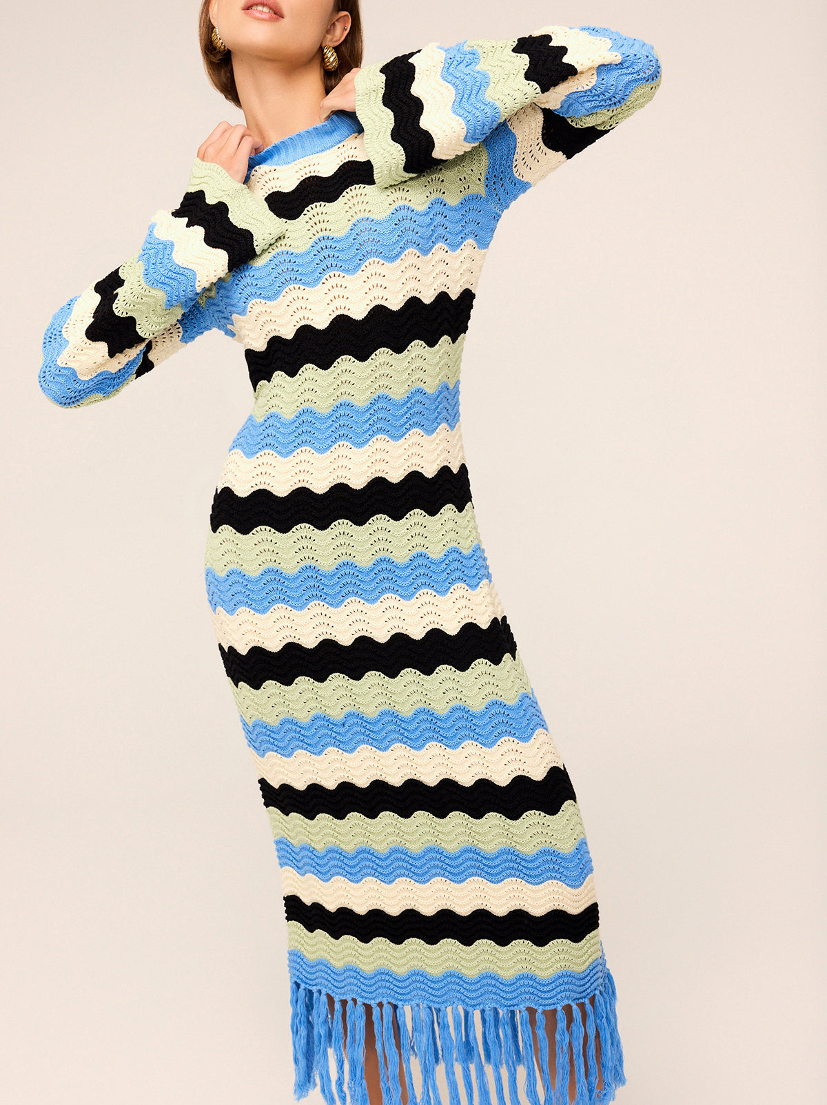 Ondine Blue Multi Crochet Knit Dress by Kitri Studio. Crochet dream.  Ondine is our latest crochet midi dress made for transitional weather in compact cotton and viscose blend yarn. Round neck. Long sleeves. Slim fit . 60% Cotton, 40% Viscose .
