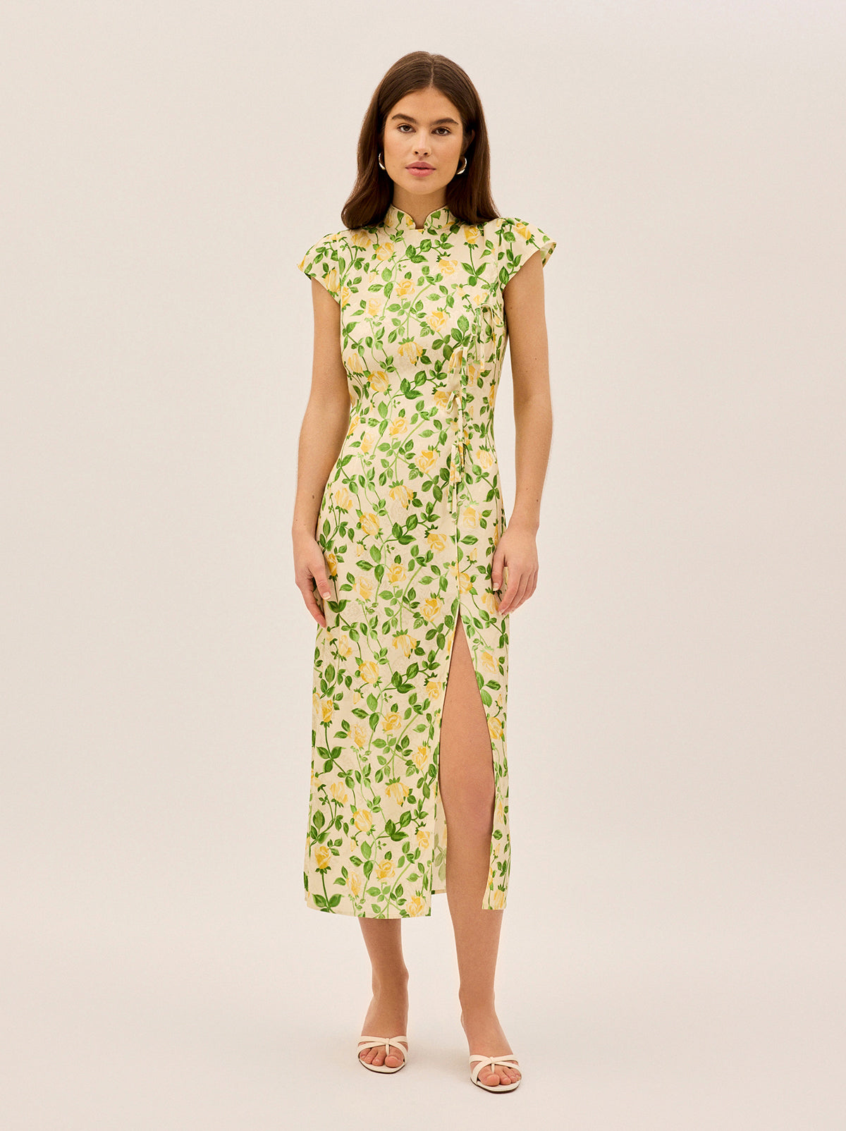 Elena Yellow Rose Printed Jacquard Dress by Kitri Studio. Meet Elena, your new favourite dress for when you want to make an effortlessly chic statement.  A modern take on the classic cheongsam silhouette, this midi dress is crafted from printed viscose jacquard with delicate tie details down the front panel and a playful split over one leg—because a little drama never hurt anyone. . . . .