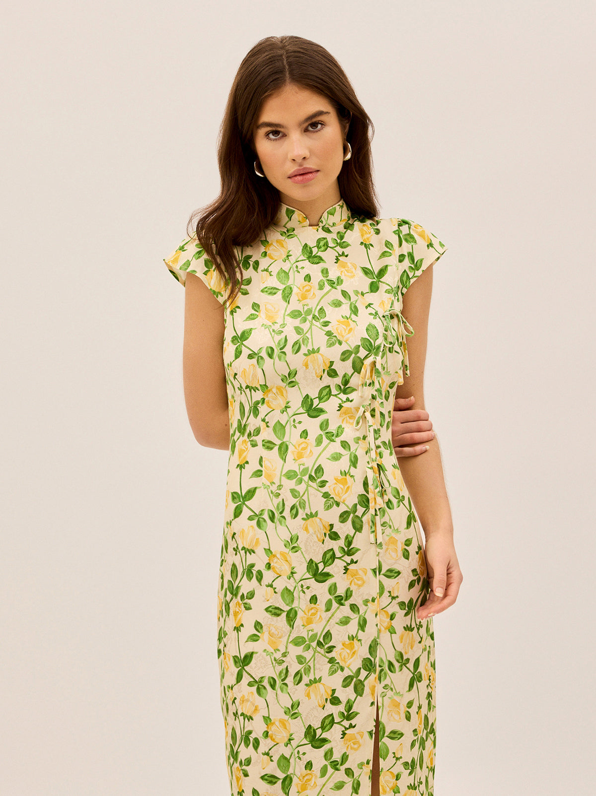Elena Yellow Rose Printed Jacquard Dress by Kitri Studio. Meet Elena, your new favourite dress for when you want to make an effortlessly chic statement.  A modern take on the classic cheongsam silhouette, this midi dress is crafted from printed viscose jacquard with delicate tie details down the front panel and a playful split over one leg—because a little drama never hurt anyone. . . . .