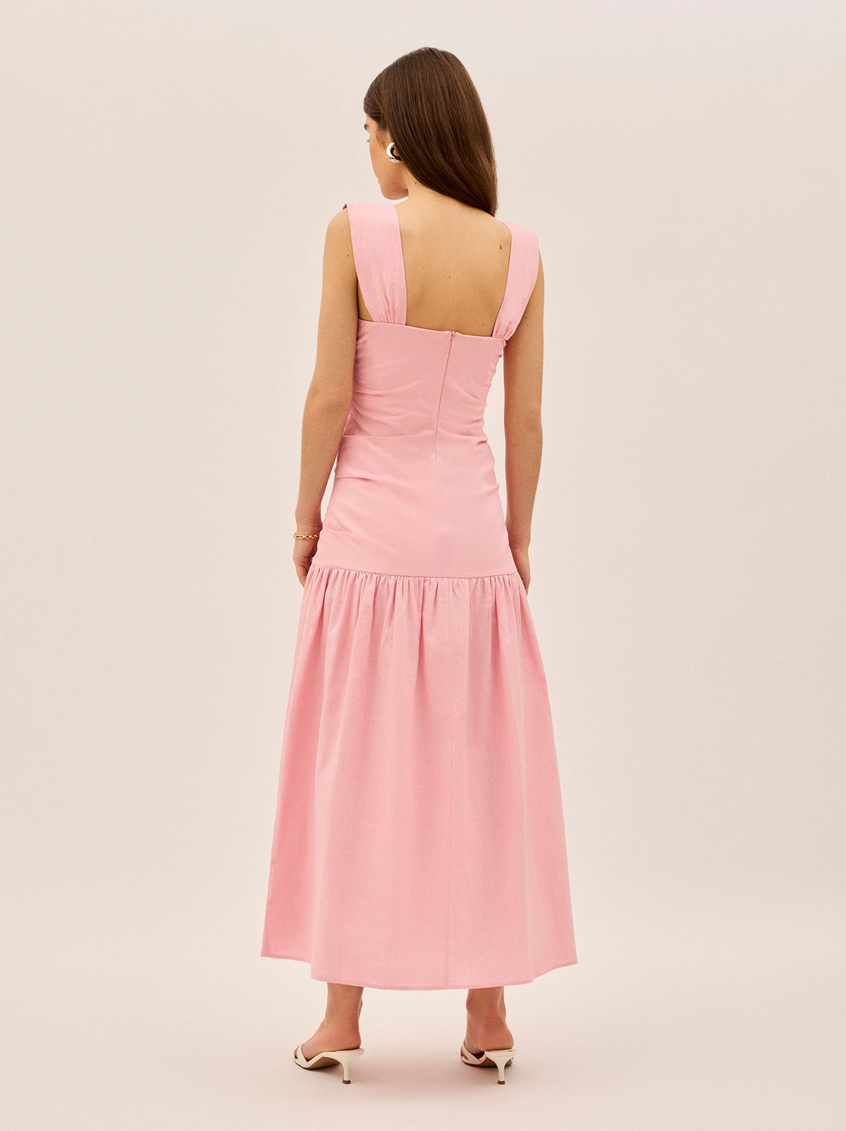 Reese Pink Cotton Linen Dress by Kitri Studio. Understated elegance meets effortless cool.  The Reese Dress is the definition of easy dressing with a fitted bodice that gathers in all the right places, a dropped waist for a relaxed yet polished silhouette, and a straight neckline that keeps things sleek. Straight neckline. Wide straps. Concealed side-zip. 50% Cotton 50% Linen  .