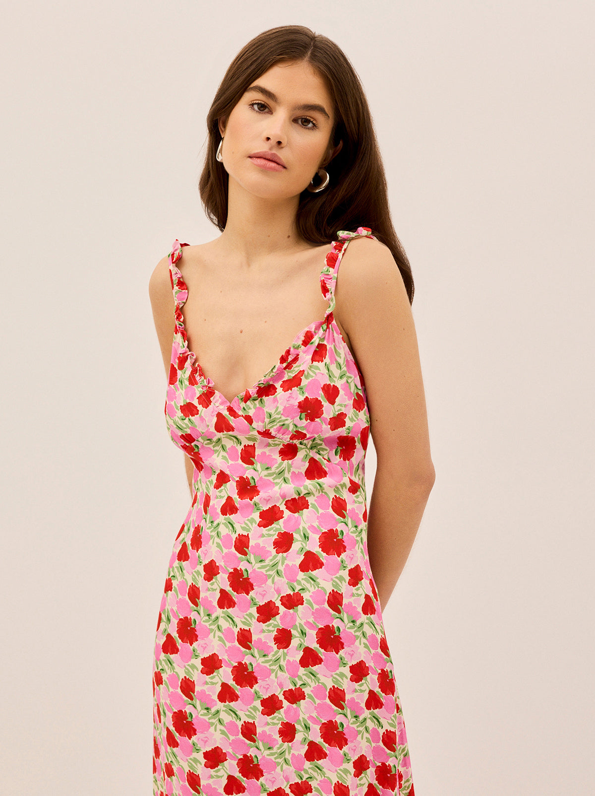 Norah Pink Floral Print Dress by Kitri Studio. Slip into something effortlessly chic.  The Norah Dress is a romantic take on the classic midi slip dress, featuring delicate micro frills along the neckline and straps for a subtle, feminine touch. V-neck. Concealed side-zip. Elasticed waist. 59%% Lenzing™ Ecovero™ Viscose  41%% Viscose.