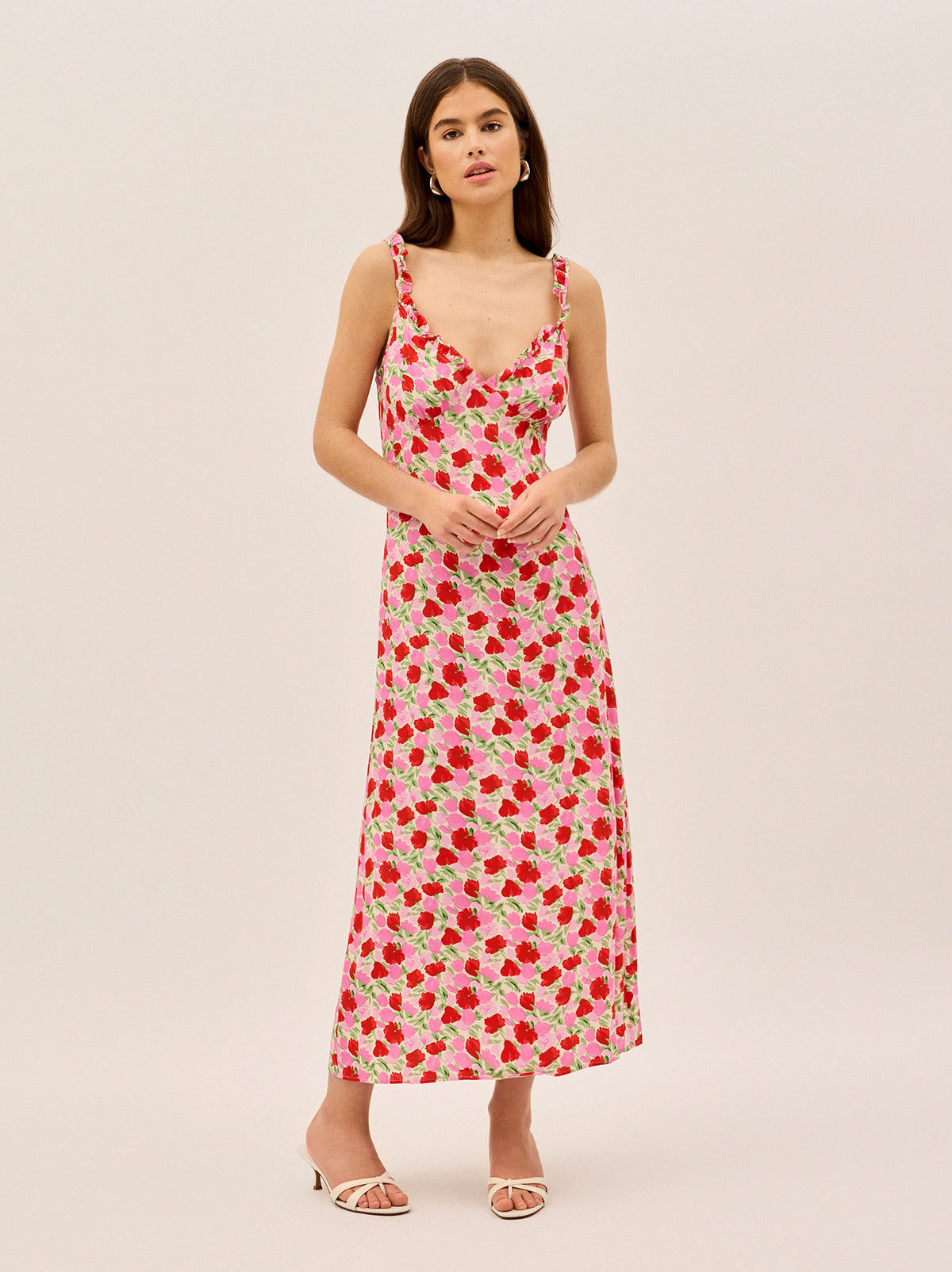 Alma Pink Floral Shirred Maxi Dress by Kitri Studio. Effortlessly romantic, the Alma Dress is your go-to for sun-drenched days and balmy evenings.  Designed with an off-shoulder neckline and a shirred bodice, this maxi dress offers a flattering, comfortable fit that hugs in all the right places. Bardot. Short sleeves. Shirred cuffs. 59%% Lenzing™ Ecovero™ Viscose 41%% Visocse Lining; 100%% Recycled Polyester.