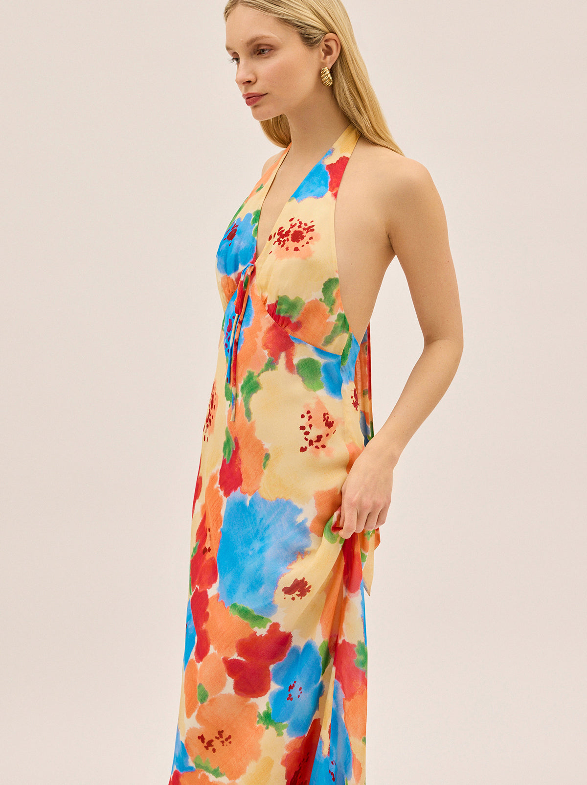 Amalia Watercolour Floral Halterneck Dress by Kitri Studio. All eyes on Amalia.  Designed in our exclusive watercolour floral print, this halterneck maxi is made for making an entrance. Halter neckline. Tie straps. Centre-back zip closure. 100% Viscose Georgette.