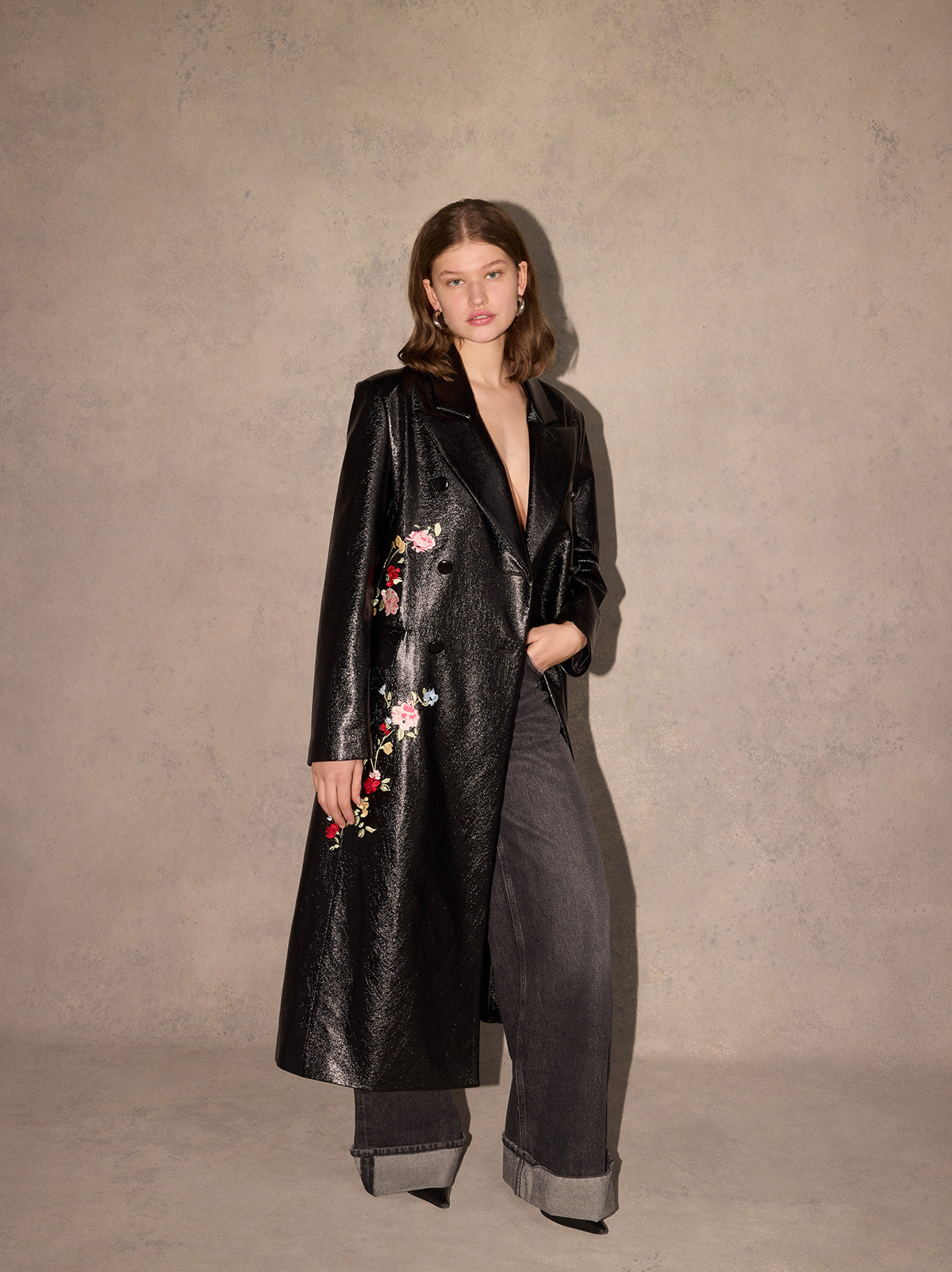 Brogan Oversized Black Embroidered Vinyl Coat - Brogan is an oversized, double-breasted coat in high-shine vinyl with an '80s-inspired statement shoulder and peaked lapel. Her bold silhouette is tempered by a tonal placement floral embroidery. Wear with co-ordinating Carolyn Black Embroidered Vinyl Mini Dress for the ultimate co-ord.