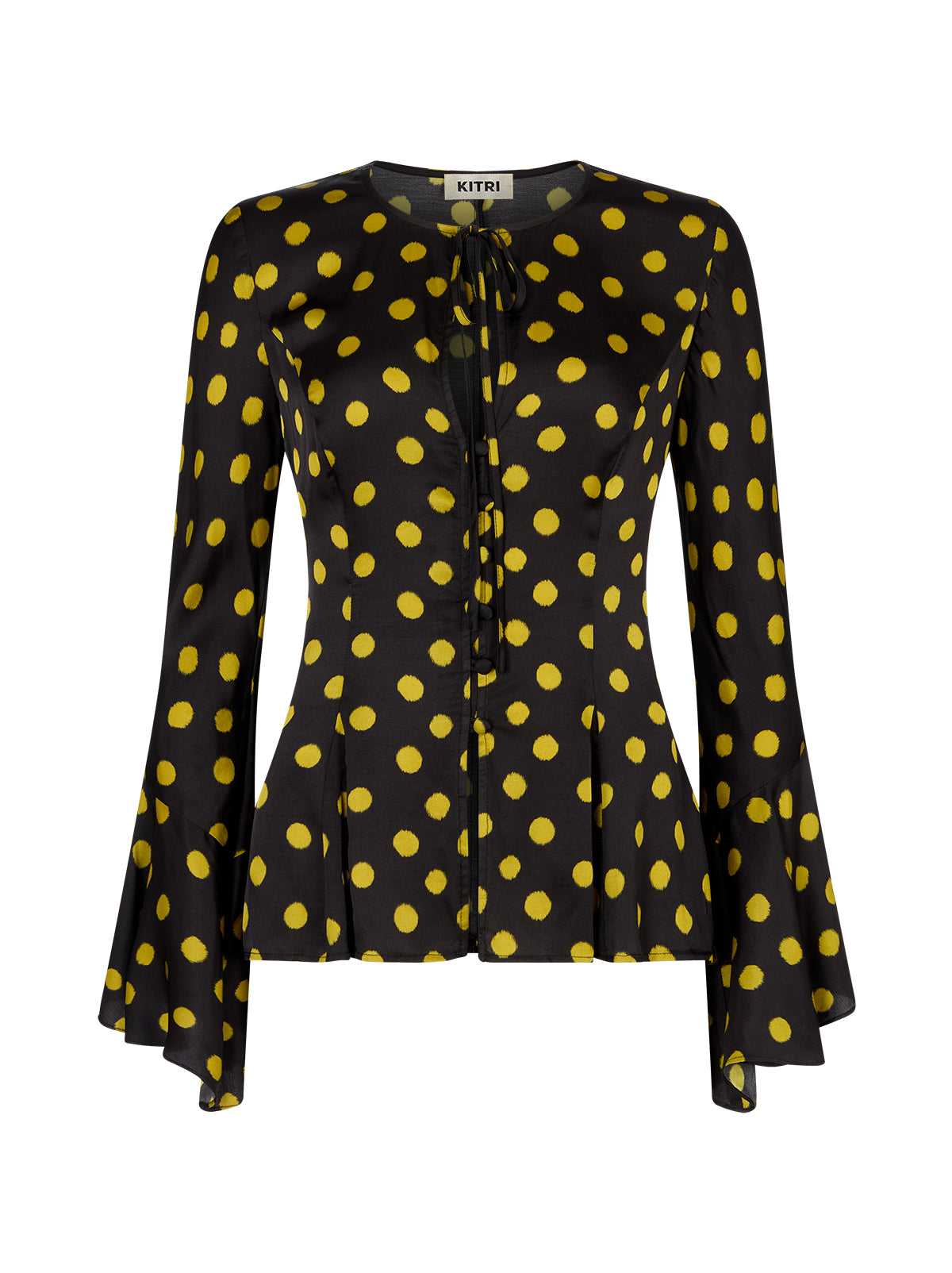 Chantelle Black Polka Dot Satin Top by Kitri Studio. The Chantelle top blends bohemian charm with modern polish in classic-with-a-twist chartreuse polka dot  print.  Crafted from lustrous and fluid viscose satin, it features flared sleeves, a wide neckline with delicate tie detail, and self-covered buttons through the front. Round neck. Flared sleeves. Button front. 100% Viscose.
