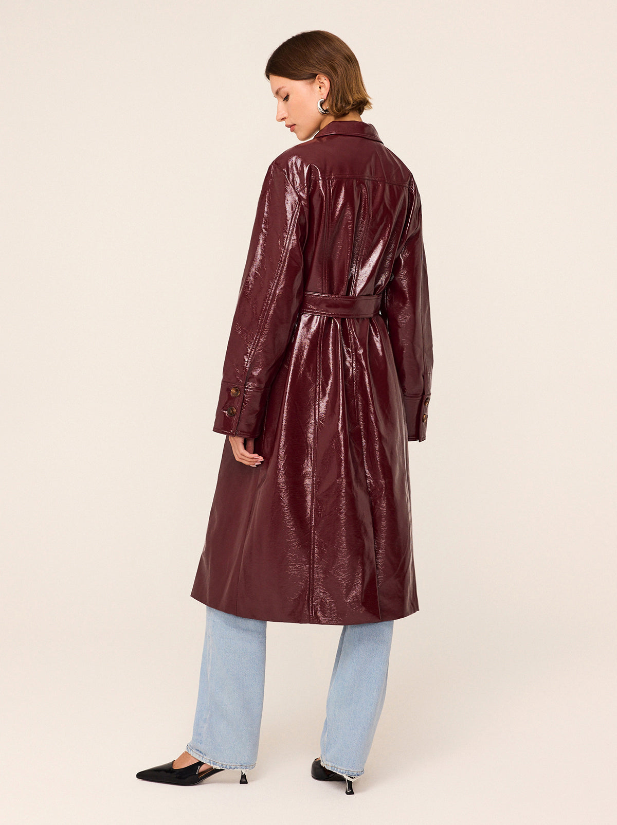 Dominique Oxblood Vinyl Coat - Dominique is an easy-fit vinyl car coat in sophisticated oxblood colour that will complete your outfit with a retro flare. Featuring exaggerated collars and patch pockets, wear with or without the belt depending on your mood.