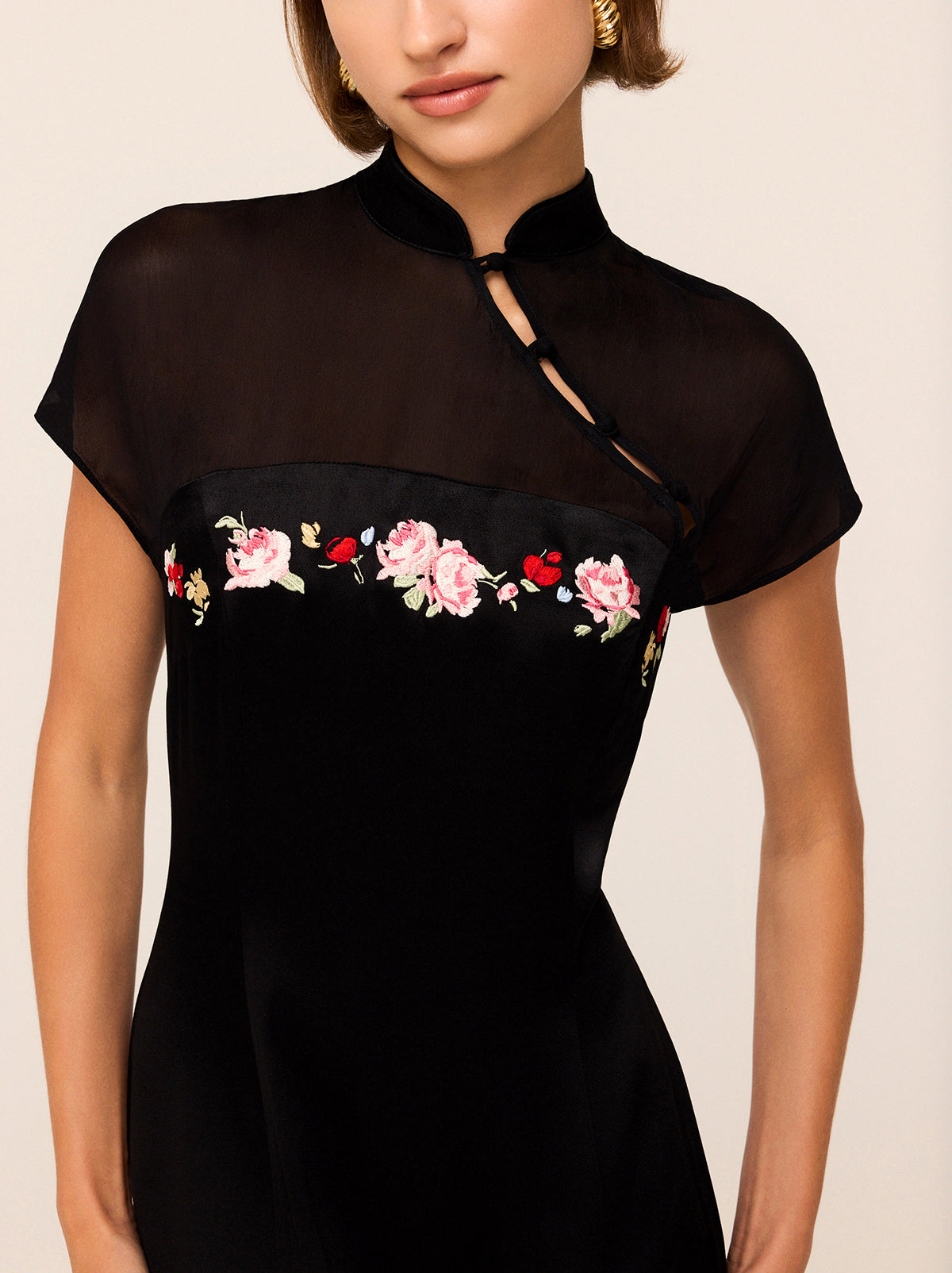 Fenella Black Embroidered Mini Dress - Fenella is a '90s-inspired mini dress crafted from a silky, lightly textured viscose blend featuring a contrasting sheer georgette yoke. She features a high-split skirt, asymmetric satin buttons and tonal floral embroidery.