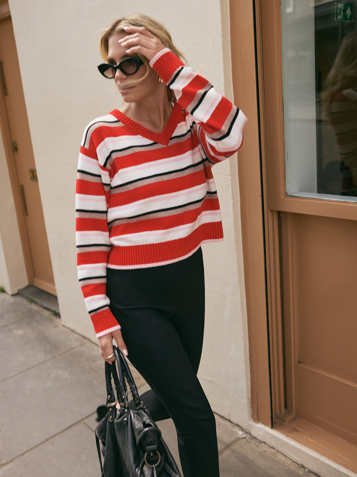 Francis Wool-Blend Striped V-neck Jumper by Kitri Studio. A fresh pop of colour for your knitwear lineup, the Francis Wool-Blend Striped V-Neck Jumper brings everyday ease with a playful twist.  Designed in a relaxed fit, it’s perfect for effortless layering while still making a statement. V-neck. Long sleeves. Relaxed Fit. 5% Cashmere, 20% Wool, 27% Viscose, 48% Nylon.