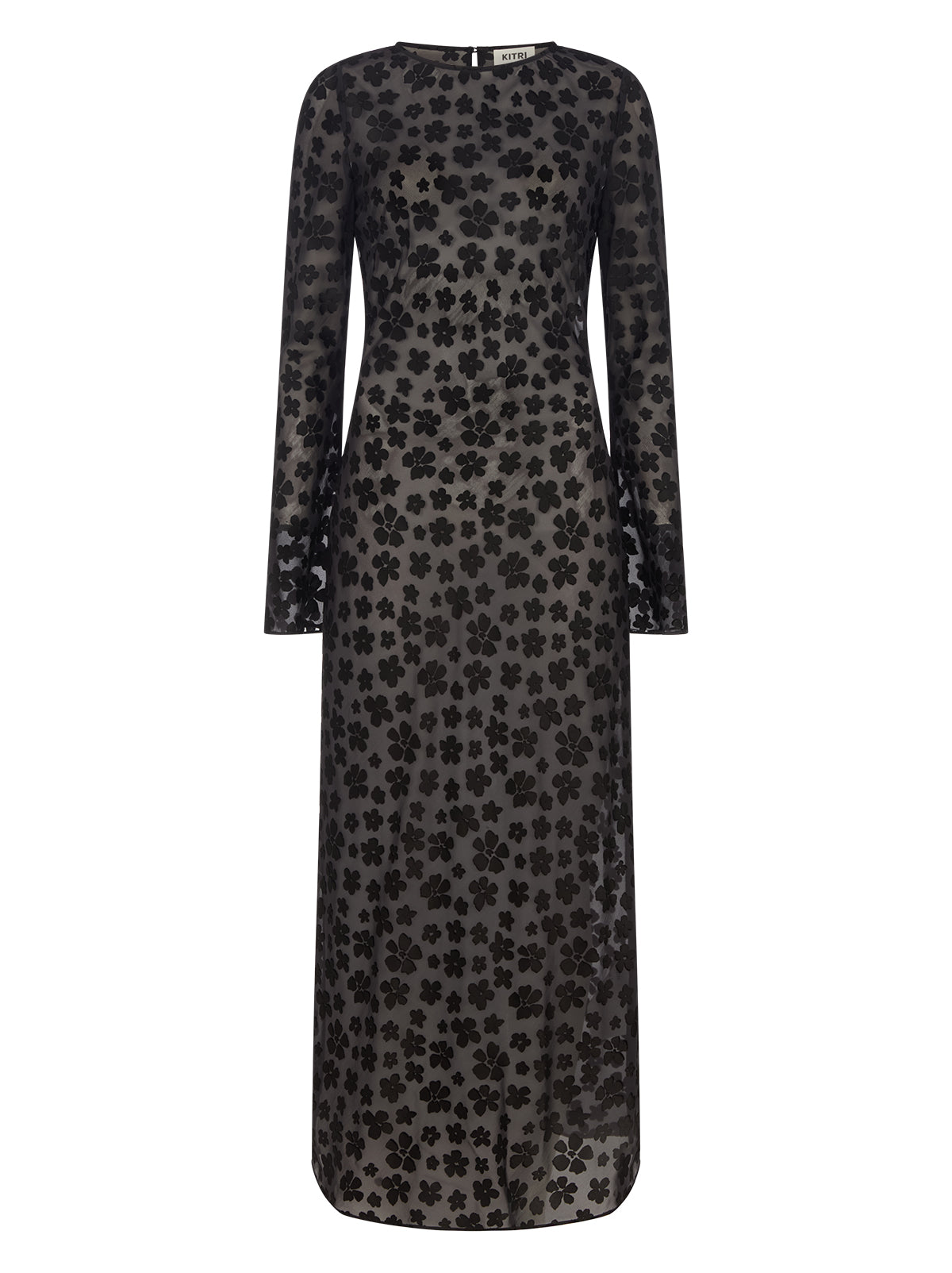 Giselle Black Floral Dress by Kitri Studio. Giselle Black Floral Dress is cut from semi-sheer satin burnout in an in-house designed black floral pattern that brings subtle texture and depth.  The bias-cut silhouette skims the body before flowing into a fluid midi length, while long flared sleeves and a wide boatneck create an elegant balance of ease and drama. Slash Neck. Long sleeves. Sheer. 75% Viscose, 25% Nylon.