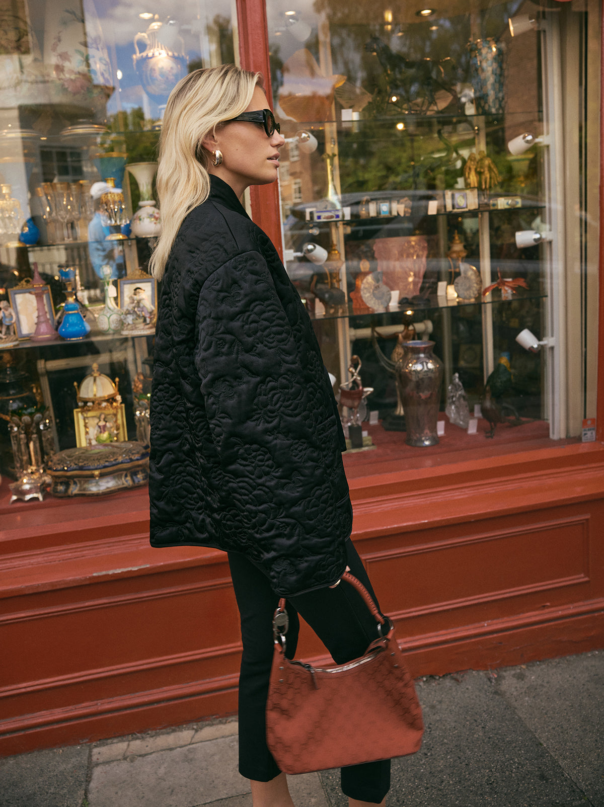 Hani Black Quilted Satin Jacket by Kitri Studio. Lightweight, versatile, and artfully detailed - the Hani jacket is designed to be worn year-round.  Cut from lustrous black viscose satin, it’s lightly quilted with an intricate floral pattern inspired by traditional Korean paintings. V-neck. Long sleeves. Front ties. 97% Viscose, 3% Elastane.