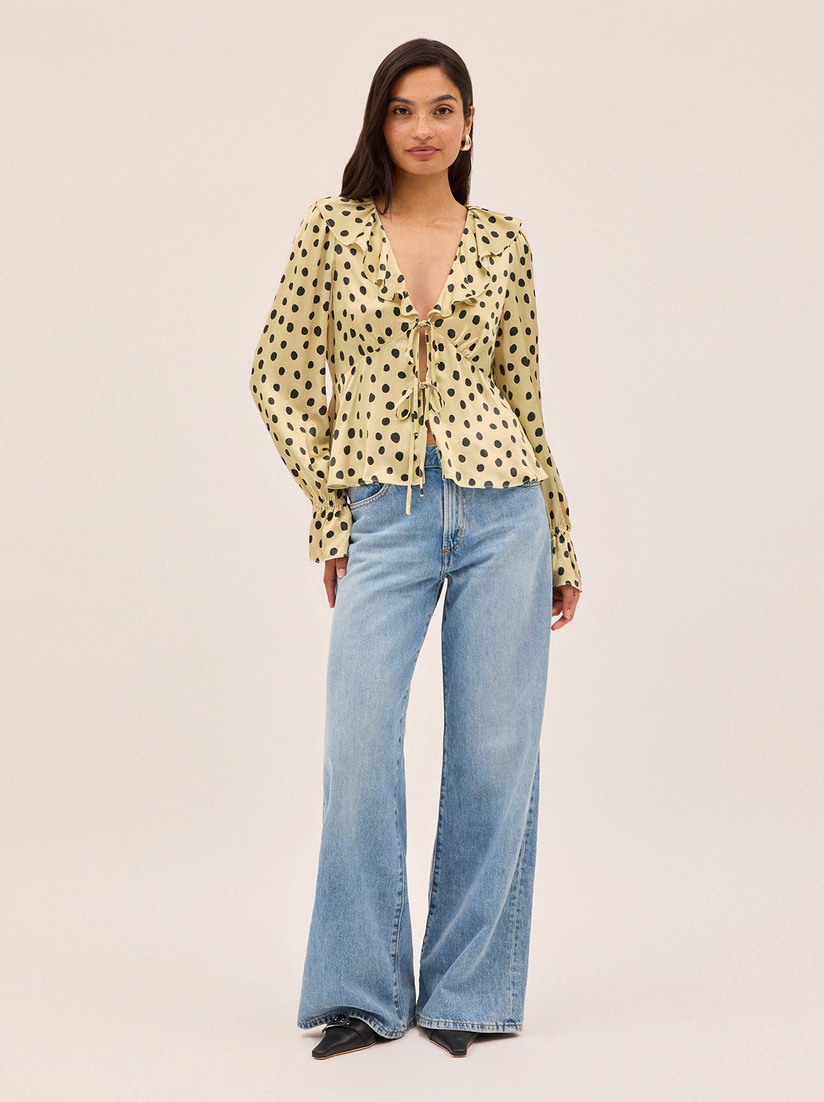 Ione Butter Polka Dot Satin Top by Kitri Studio. <span style="font-family: -apple-system, BlinkMacSystemFont, 'San Francisco', 'Segoe UI', Roboto, 'Helvetica Neue', sans-serif; font-size: 0. 875rem;">Romantic and effortless, the Ione top is new silhouette in soft, fluid viscose satin. V-neck. Long sleeves. Elasticated cuffs. 100% Viscose Satin.