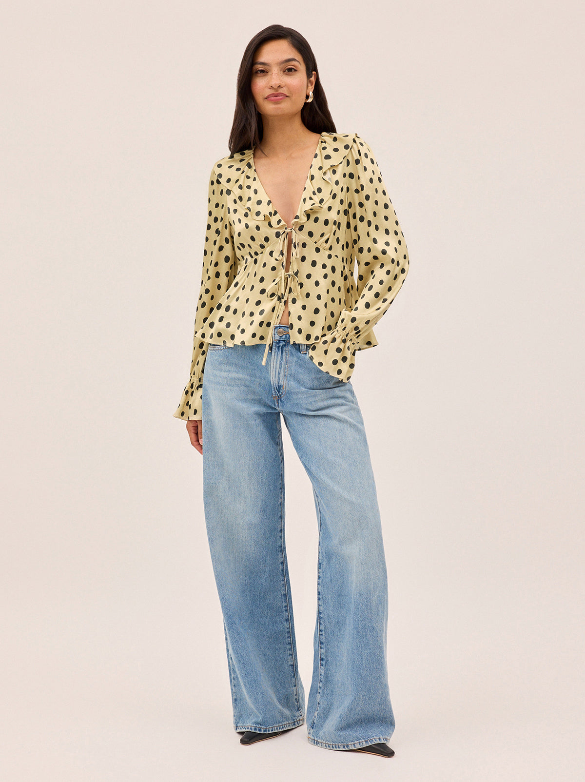 Ione Butter Polka Dot Satin Top by Kitri Studio. <span style="font-family: -apple-system, BlinkMacSystemFont, 'San Francisco', 'Segoe UI', Roboto, 'Helvetica Neue', sans-serif; font-size: 0. 875rem;">Romantic and effortless, the Ione top is new silhouette in soft, fluid viscose satin. V-neck. Long sleeves. Elasticated cuffs. 100% Viscose Satin.