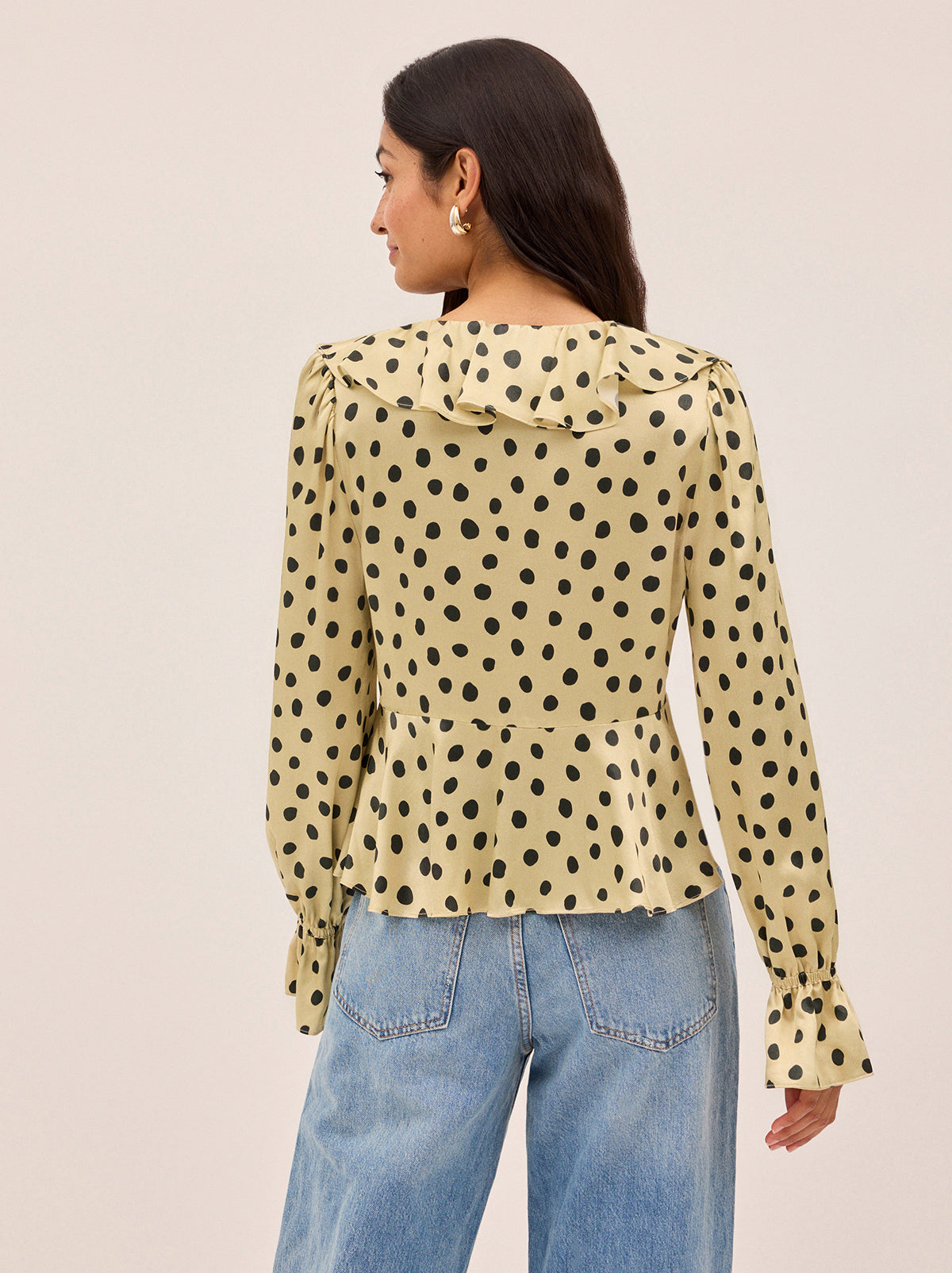 Ione Butter Polka Dot Satin Top by Kitri Studio. <span style="font-family: -apple-system, BlinkMacSystemFont, 'San Francisco', 'Segoe UI', Roboto, 'Helvetica Neue', sans-serif; font-size: 0. 875rem;">Romantic and effortless, the Ione top is new silhouette in soft, fluid viscose satin. V-neck. Long sleeves. Elasticated cuffs. 100% Viscose Satin.