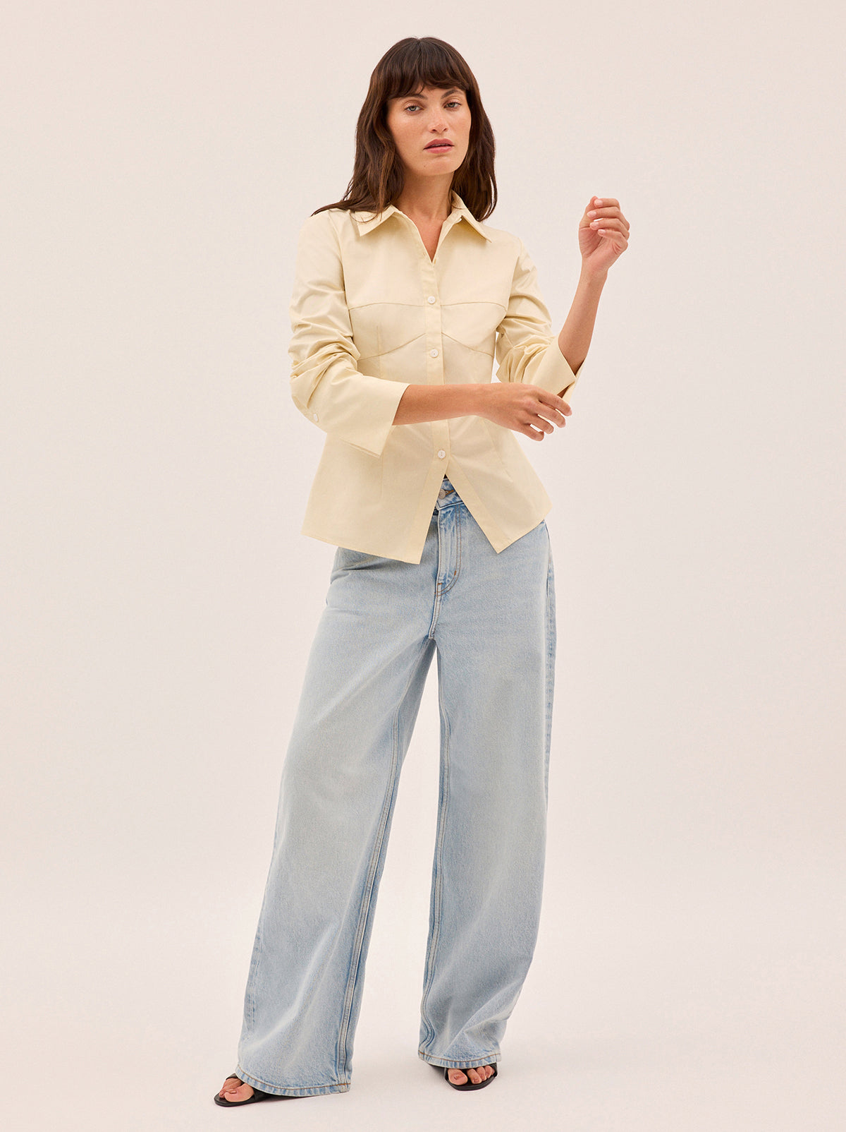 Jesse Vanilla Cotton Shirt by Kitri Studio. A refined take on a wardrobe classic.  The Jesse shirt debuts a new silhouette, cut from mid-weight 100% cotton in a soft vanilla hue. Collared neckline. Flared sleeves. Buttoned cuffs. 100% Cotton.