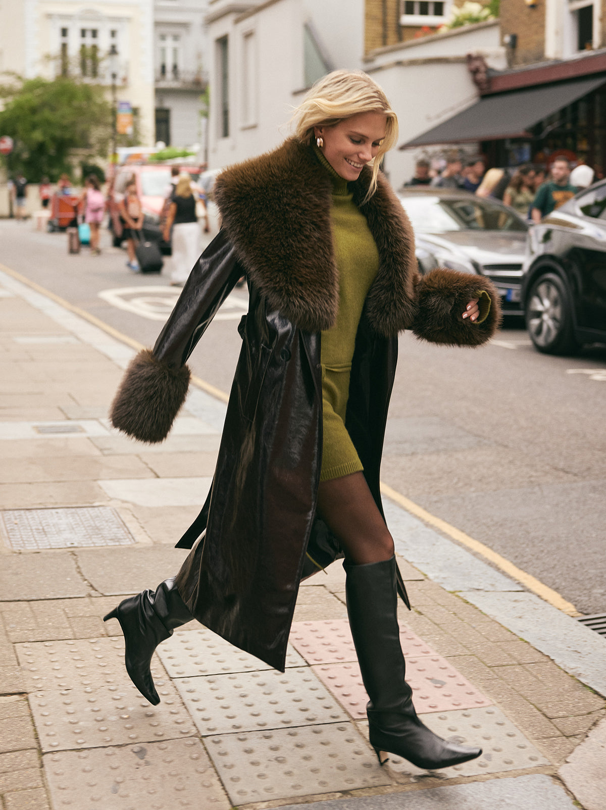 Lara Dark Chocolate Vinyl Coat by Kitri Studio. All eyes on Lara - dare we say, THE coat of the season and the ultimate statement-maker.  Cut from premium, chocolate brown vinyl, this double-breasted showstopper is finished with a detachable plush faux-fur collar and cuffs in deep chocolate for maximum drama. Collared neckline. Long sleeves. Button front. Main: 100% PU, Faux-Fur: 100% Polyester.