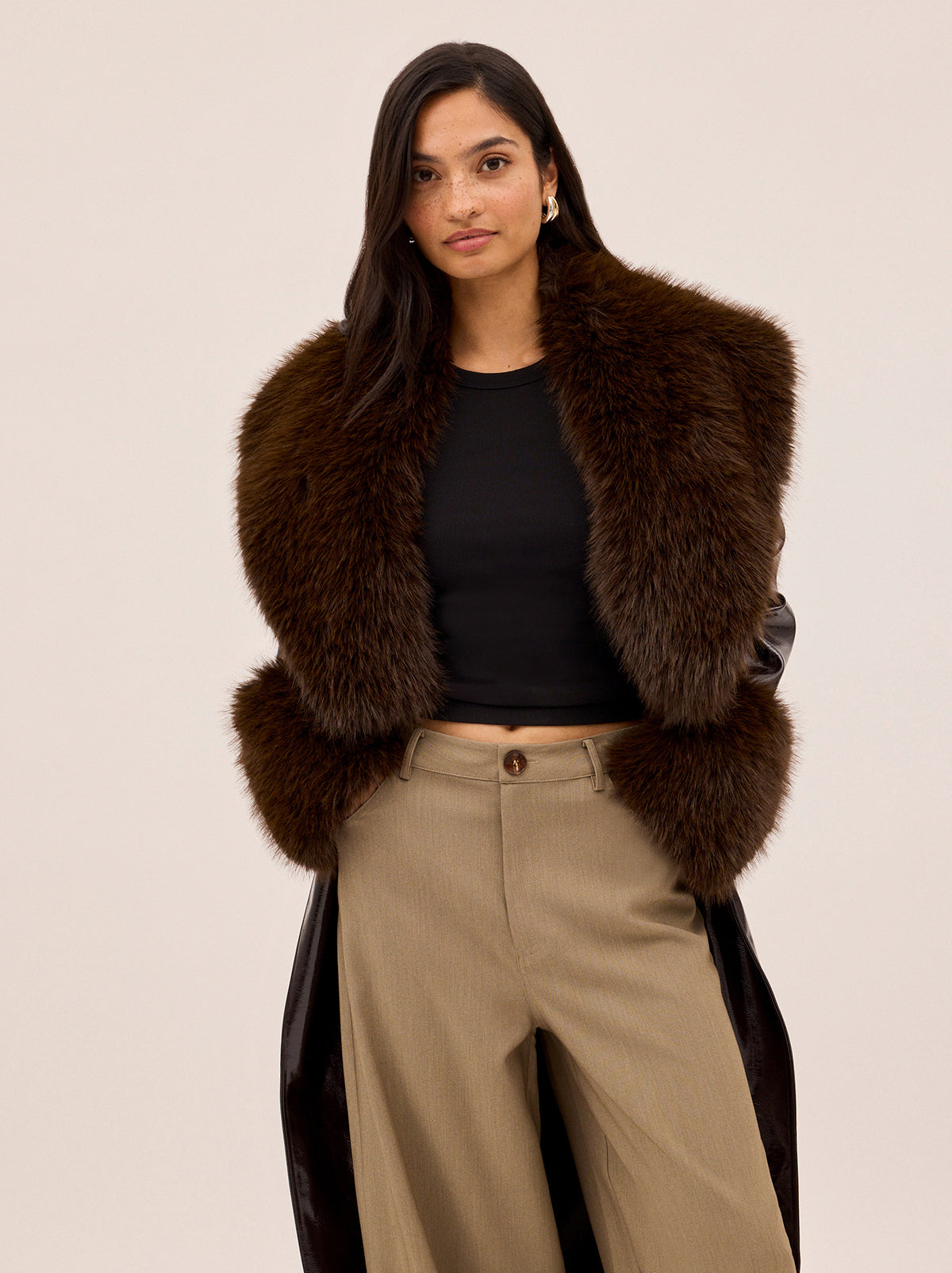 Lara Dark Chocolate Vinyl Coat by Kitri Studio. All eyes on Lara - dare we say, THE coat of the season and the ultimate statement-maker.  Cut from premium, chocolate brown vinyl, this double-breasted showstopper is finished with a detachable plush faux-fur collar and cuffs in deep chocolate for maximum drama. Collared neckline. Long sleeves. Button front. Main: 100% PU, Faux-Fur: 100% Polyester.