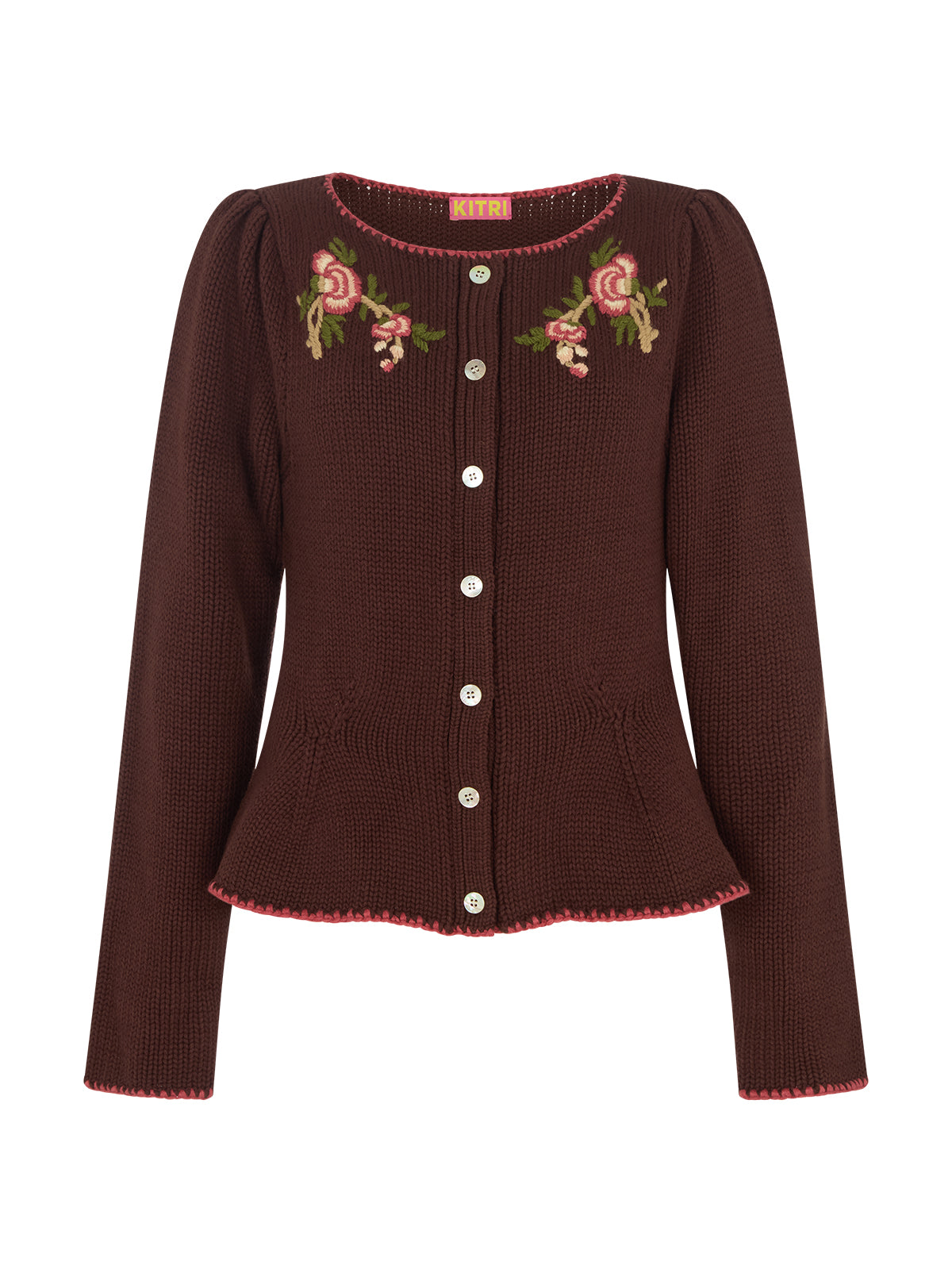 Leonie Chocolate Embroidered Knit Cardigan by Kitri Studio. A true heirloom-in-the-making, this vintage-inspired knit cardigan blends craftsmanship with everyday wearability.  Spun from a mid-weight cotton-wool blend, it’s detailed with intricate, hand-embroidered florals in rich autumnal tones. Slash Neck. Long sleeves. Button front. 60% Cotton, 30% Nylon, 10% Wool.