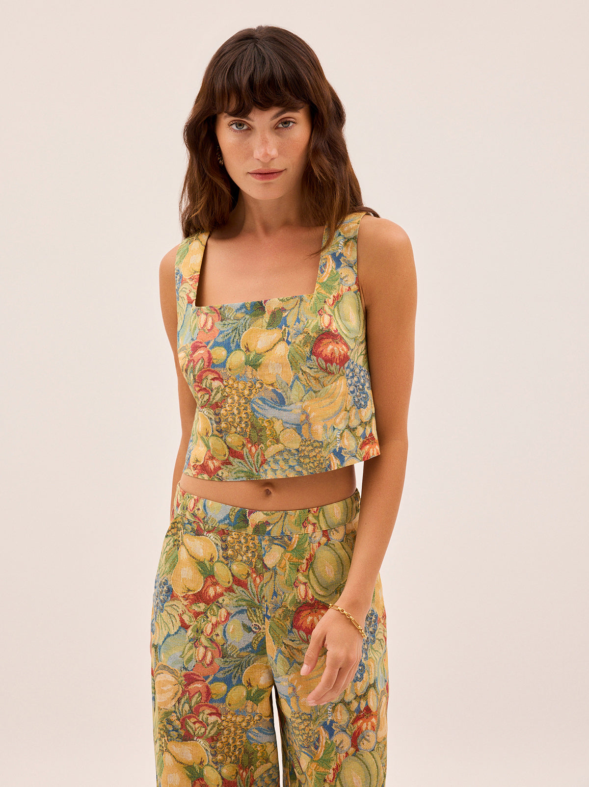Maeve Fruit Print Top by Kitri Studio. Our bestselling silhouette, reimagined in a vibrant fruit print.  The Maeve Top features a flattering square neckline and a relaxed, easy fit that pairs perfectly with denim, linen or the matching trousers. Square neckline. Wide straps. Loose fit. 50% Cotton, 50% Linen.