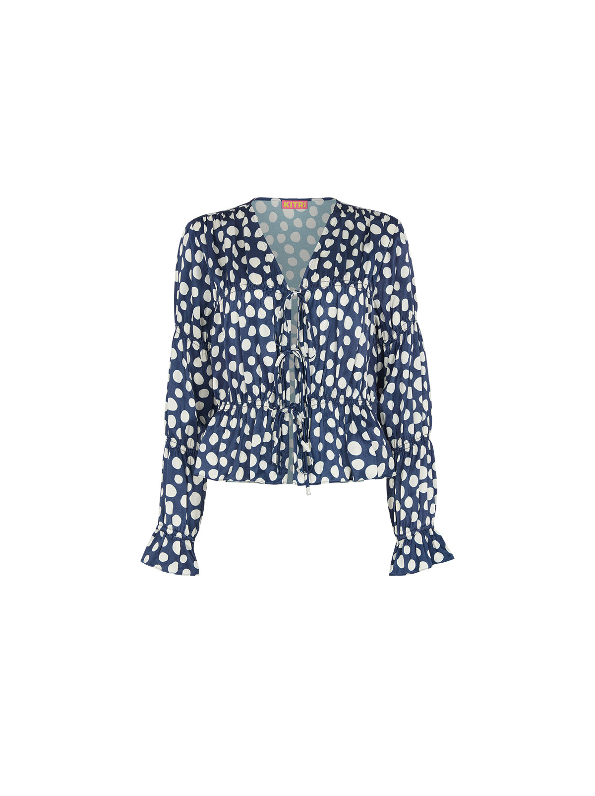 Maia Navy Polka Dot Satin Top by Kitri Studio. Vintage-inspired with a modern edge, the Maia Top is here to elevate your wardrobe.  Designed in luxurious satin with a flattering gathered bodice and sleeves, this long-sleeve blouse brings effortless femininity to any look. V-neck. Long sleeves. Frilled cuffs. 100%% Viscose.