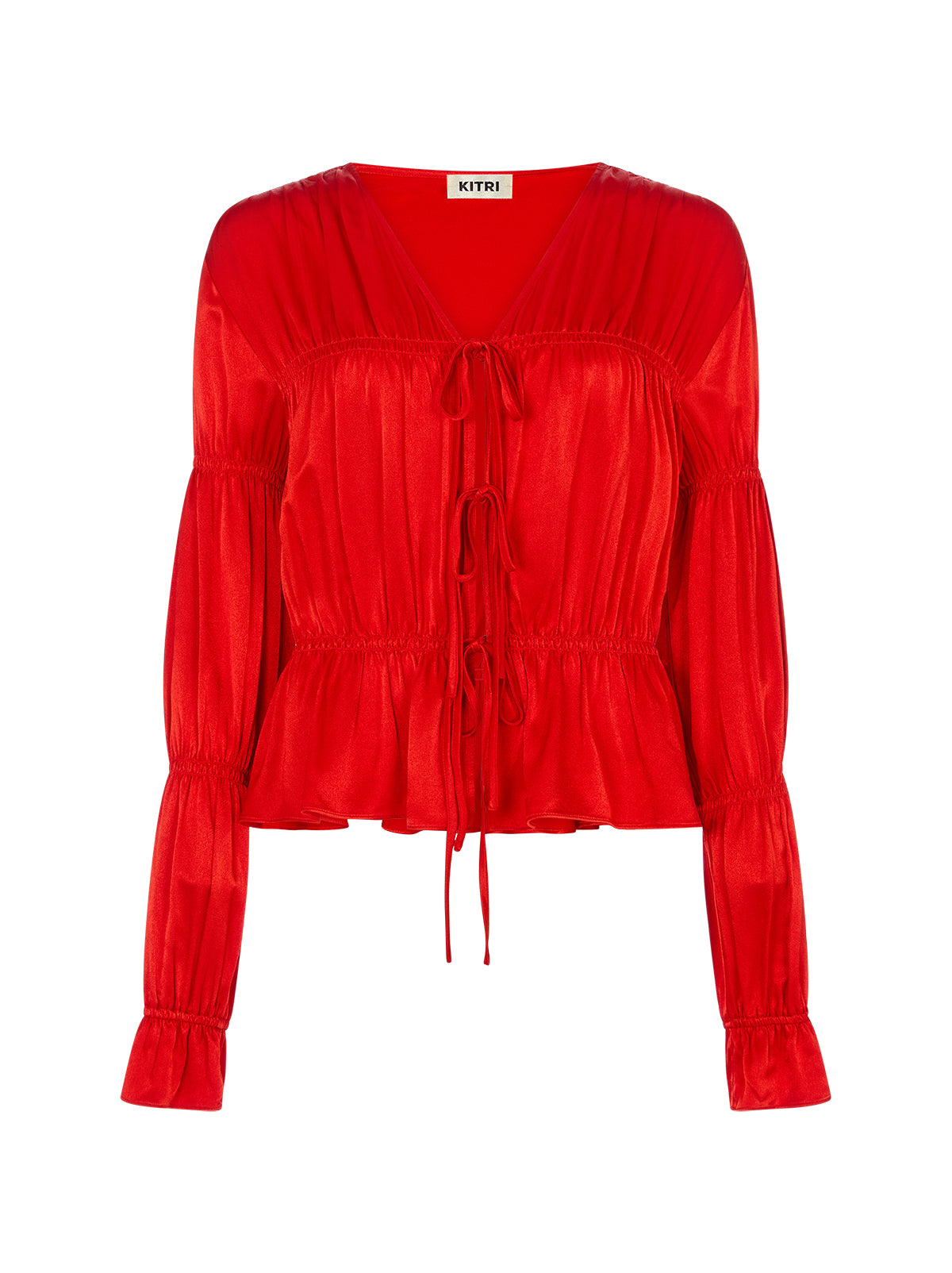 Maia Red Satin Top by Kitri Studio. Vintage-inspired with a modern edge, the Maia Top in brilliant red is here to elevate your wardrobe.  Designed in luxurious satin with a flattering gathered bodice and sleeves, this long-sleeve blouse brings effortless femininity to any look. V-neck. Long sleeves. Elasticated cuffs. 100% Viscose Satin.