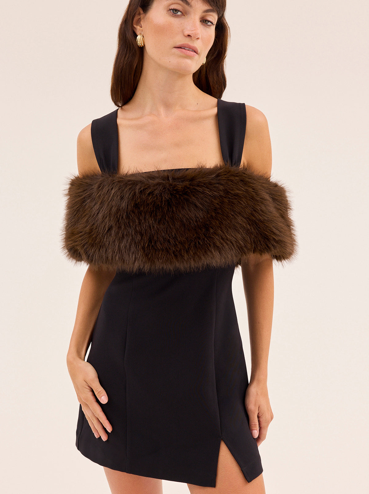 Marcella Black Mini Dress by Kitri Studio. A little black dress with maximum versatility, the Marcella is your go-to for statement evenings.  Crafted in a flattering wide-strap silhouette with a straight neckline, this mini dress comes with a detachable dark chocolate faux-fur stole - offering two looks in one. Adjustable straps. Back-zip. Fitted. Main: 74% Polyester, 20% Rayon, 6% Elastane Faux Fur: 100% Polyester.