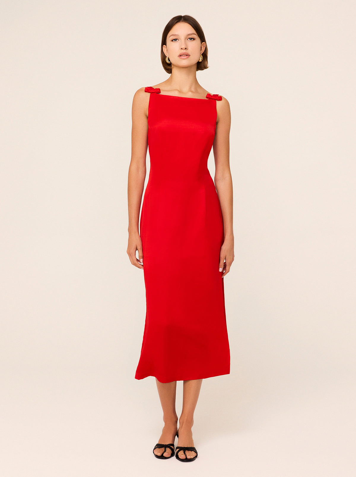 Nikita Red Satin Midi Dress - Nikita is an elegant, '90s-inspired midi dress with a split sheath skirt and low back. She's crafted from a premium salsa red viscose linen blend, providing a subtle sheen and unique rippling effect. Her bow details add a feminine touch and heralds the ballet-theme at the heart of our collection.