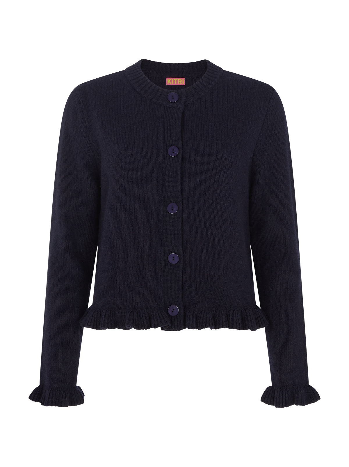Odille Navy Knit Cardigan by Kitri Studio. The Odile cardigan is a refined wardrobe staple with a playful twist.  Knitted from a soft, mid-weight cashmere blend, it features a classic button-down front, with delicate frill detailing at the hem and cuffs. Round neck. Long sleeves. Frilled cuffs. 48% Nylon, 27% Viscose, 20% Wool, 5% Cashmere.