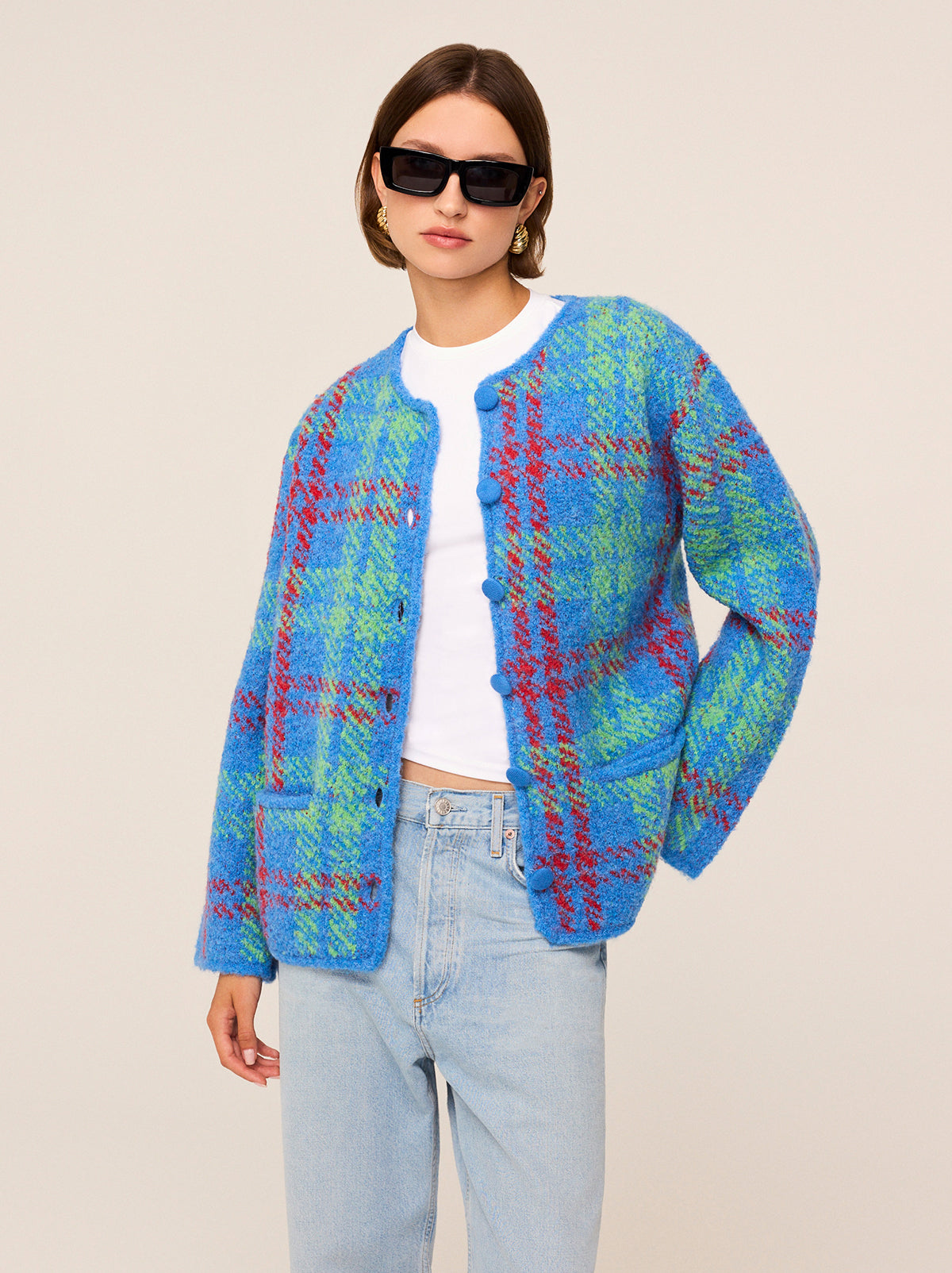 Pandora Blue Check Bouclé Knit Cardigan - Pandora is a chunky, wool-blend cardigan featuring a bold check print inspired by the punk-chic runways of the '90s. A fresh cobalt blue base is crisscrossed with shocks of red and green, and her cosy bouclé fabric makes her the perfect extra layer as the weather cools. 