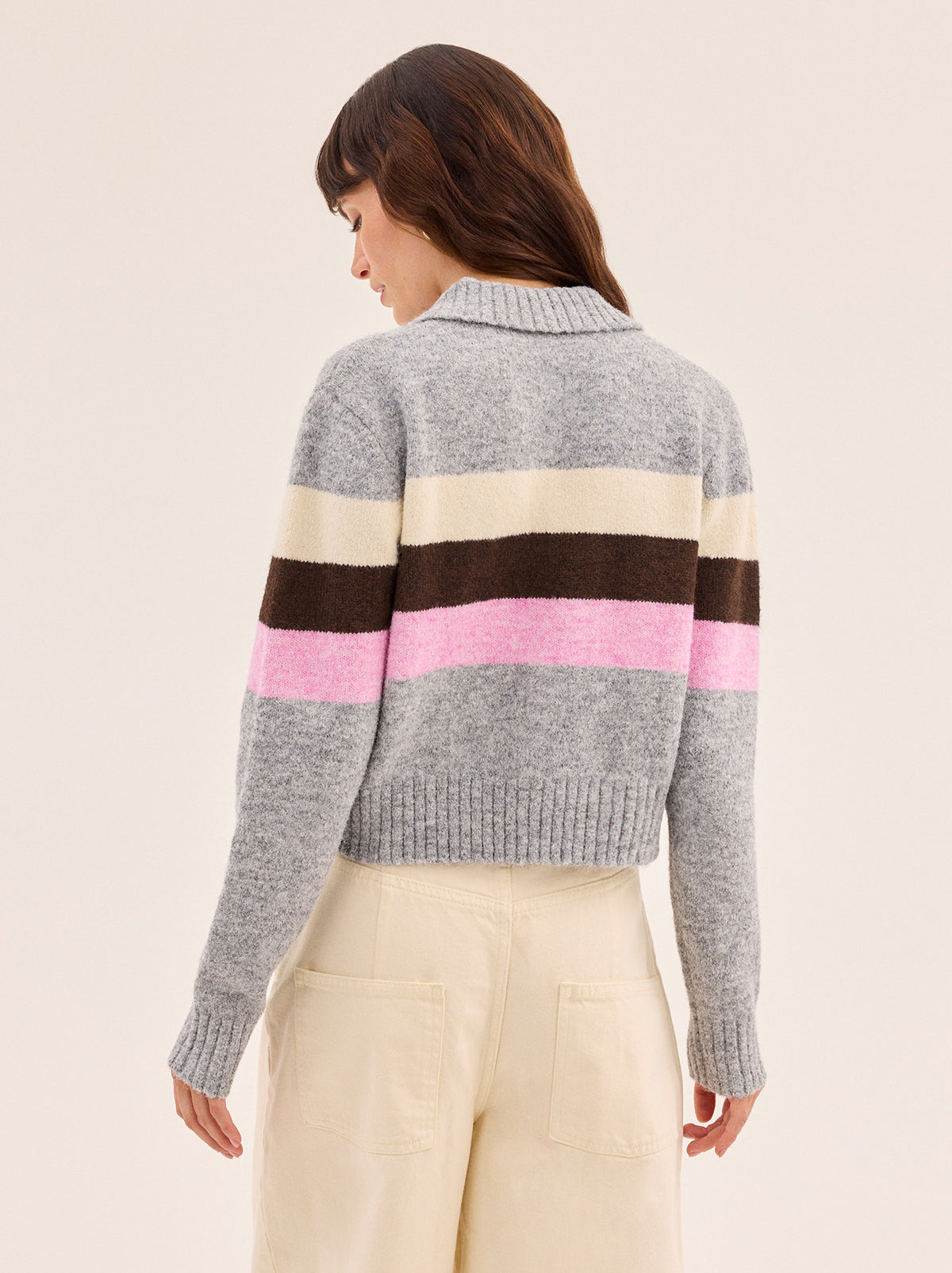 Romy Grey Neapolitan Stripe Knit Cardigan by Kitri Studio. Romy Grey Neapolitan Stripe Knit Cardigan is knitted in a soft wool-blend with playful stripes inspired by classic Neapolitan ice cream.  Designed with a neat collar and button-through front, it strikes the balance between cosy and polished. Collared neckline. Long sleeves. Ribbed cuffs. 59% Recycled Polyester, 21% Nylon, 11% Polyester, 8% Wool, 1% Elastane.