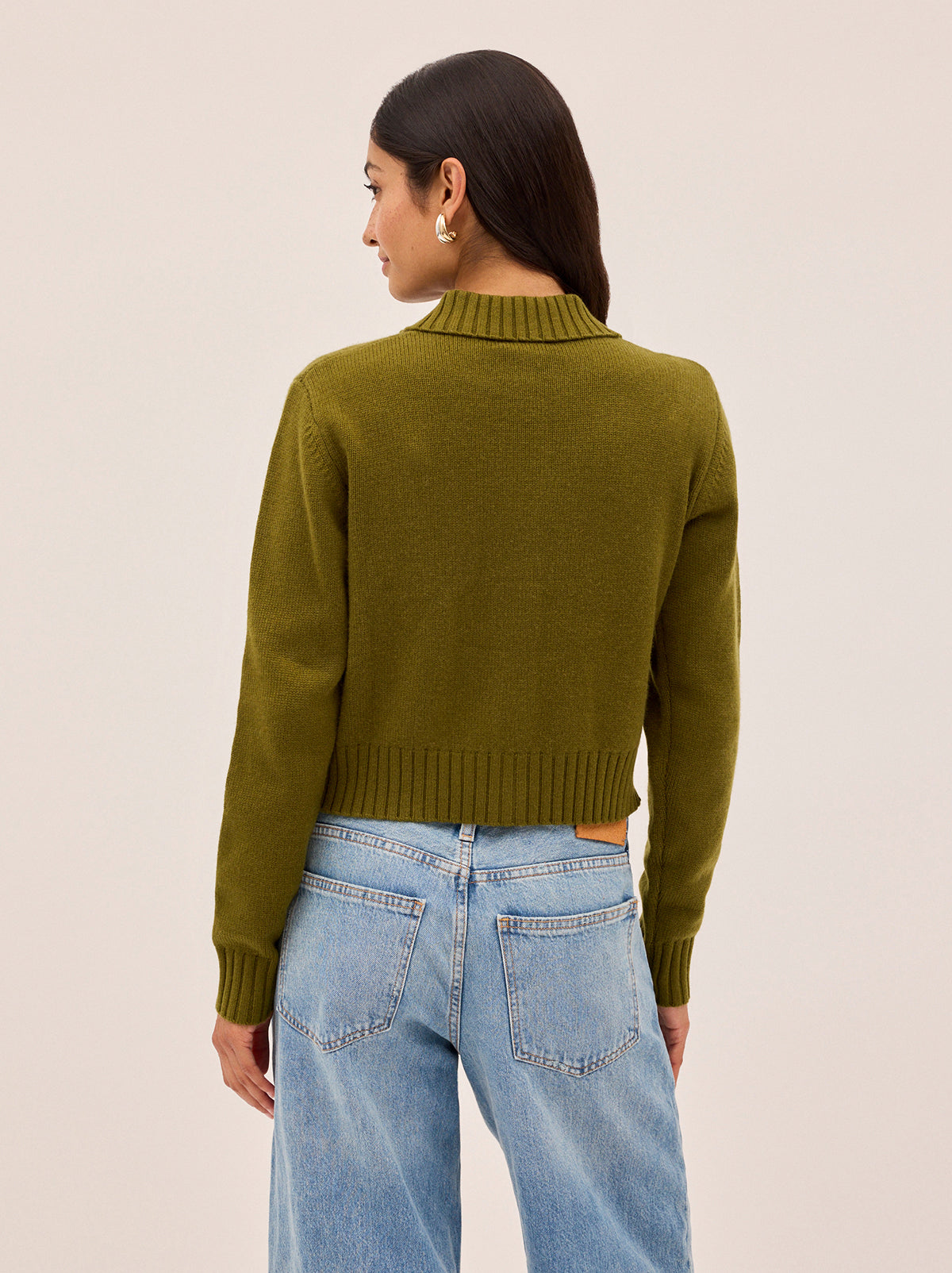 Romy Olive Wool-Blend Collared Cardigan by Kitri Studio. A soft layering piece with a touch of romance, this lightweight cardigan is crafted from a cosy wool–cashmere blend in an endlessly versatile olive green.  Designed with a neat collar, it comes with a detachable knitted rose flower at the neck for a playful, feminine twist. Collared neckline. Long sleeves. . 5% Cashmere, 20% Wool, 27% Viscose, 48% Nylon.