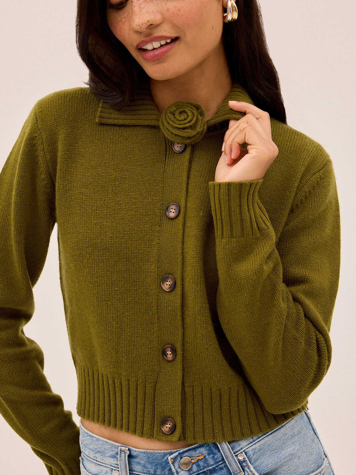 Romy Olive Wool-Blend Collared Cardigan by Kitri Studio. A soft layering piece with a touch of romance, this lightweight cardigan is crafted from a cosy wool–cashmere blend in an endlessly versatile olive green.  Designed with a neat collar, it comes with a detachable knitted rose flower at the neck for a playful, feminine twist. Collared neckline. Long sleeves. . 5% Cashmere, 20% Wool, 27% Viscose, 48% Nylon.