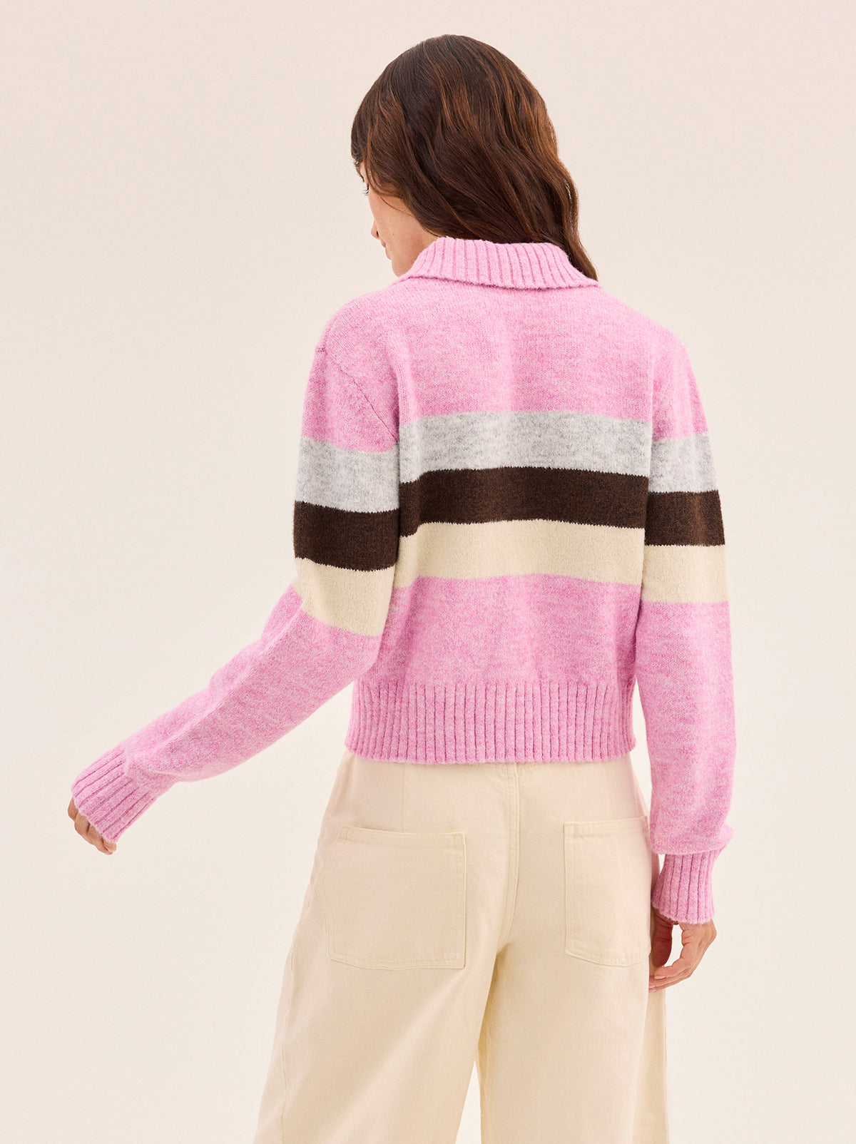 Romy Pink Neapolitan Stripe Knit Cardigan by Kitri Studio. Romy Pink Neapolitan Stripe Knit Cardigan is knitted in a soft wool-blend with playful stripes inspired by classic Neapolitan ice cream.  Designed with a neat collar and button-through front, it strikes the balance between cosy and polished. Collared neckline. Long sleeves. Ribbed cuffs. 59% Recycled Polyester, 21% Nylon, 11% Polyester, 8% Wool, 1% Elastane.