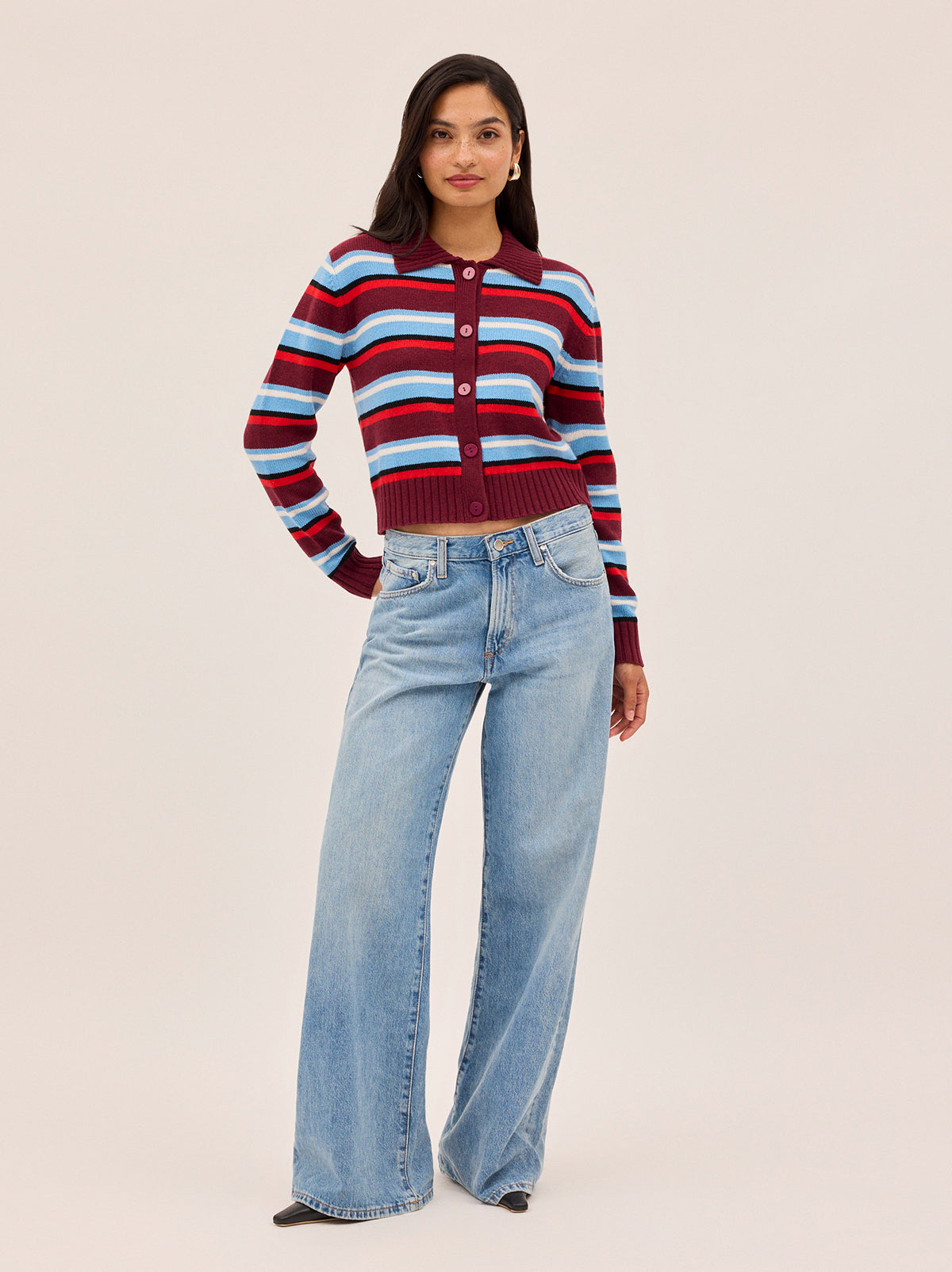 Romy Wool-Blend Striped Collared Cardigan by Kitri Studio. Crafted from a soft wool and cashmere blend, the Romy cardigan combines lightweight comfort with bold design.  Stripes in rich burgundy and powder blue create a vibrant contrast, while a classic collar, button-down front, and ribbed trims give it a timeless finish. Round neck. Long sleeves. Button front. 5% Cashmere, 20% Wool, 27% Viscose, 48% Nylon.