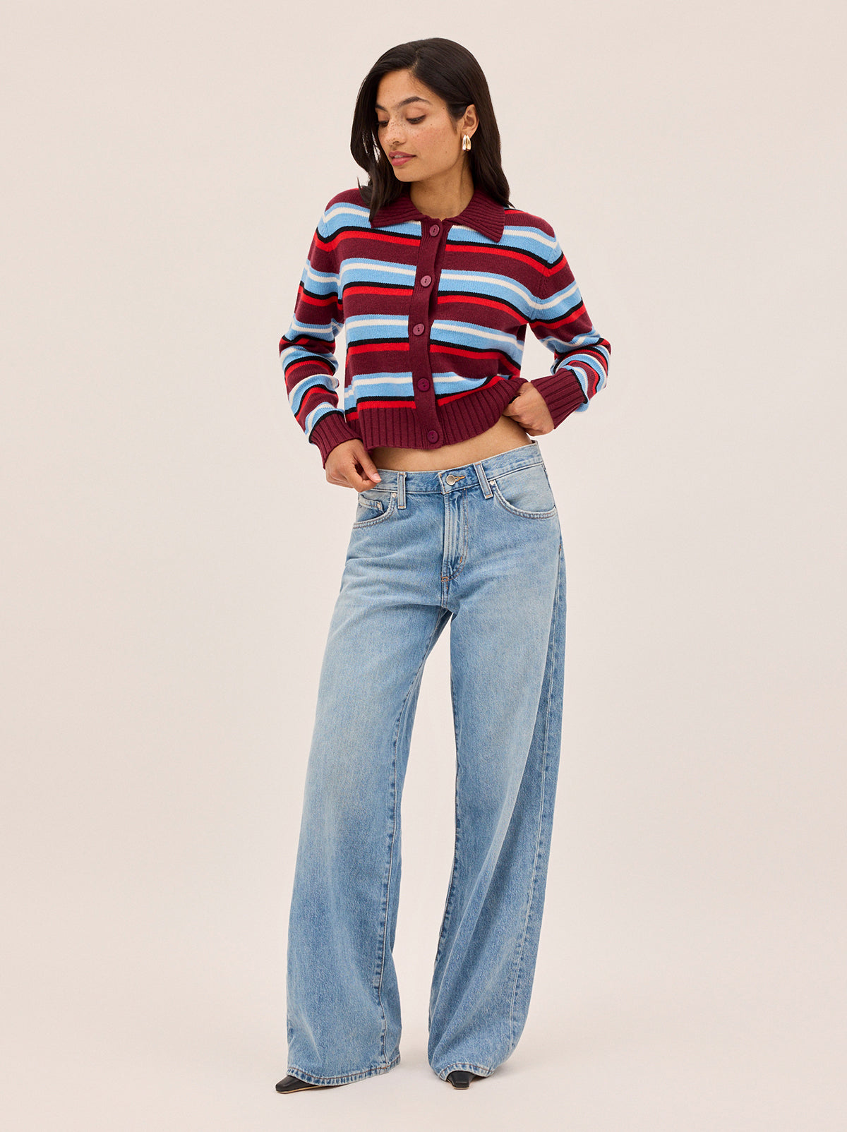 Romy Wool-Blend Striped Collared Cardigan by Kitri Studio. Crafted from a soft wool and cashmere blend, the Romy cardigan combines lightweight comfort with bold design.  Stripes in rich burgundy and powder blue create a vibrant contrast, while a classic collar, button-down front, and ribbed trims give it a timeless finish. Round neck. Long sleeves. Button front. 5% Cashmere, 20% Wool, 27% Viscose, 48% Nylon.