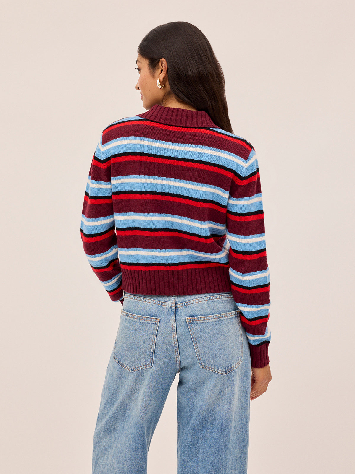 Romy Wool-Blend Striped Collared Cardigan by Kitri Studio. Crafted from a soft wool and cashmere blend, the Romy cardigan combines lightweight comfort with bold design.  Stripes in rich burgundy and powder blue create a vibrant contrast, while a classic collar, button-down front, and ribbed trims give it a timeless finish. Round neck. Long sleeves. Button front. 5% Cashmere, 20% Wool, 27% Viscose, 48% Nylon.