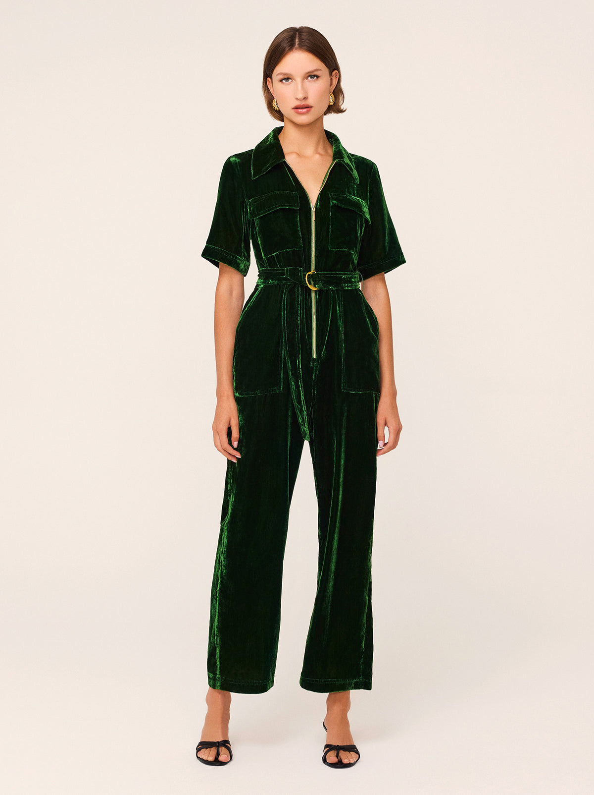 Serena Green Velvet Jumpsuit - One-and-done piece you need in your wardrobe. Serena is a fitted velvet jumpsuit in rich forest green velvet. Featuring a gold centre zip and patch pockets, it's relaxed through the leg with a slightly flared hem.