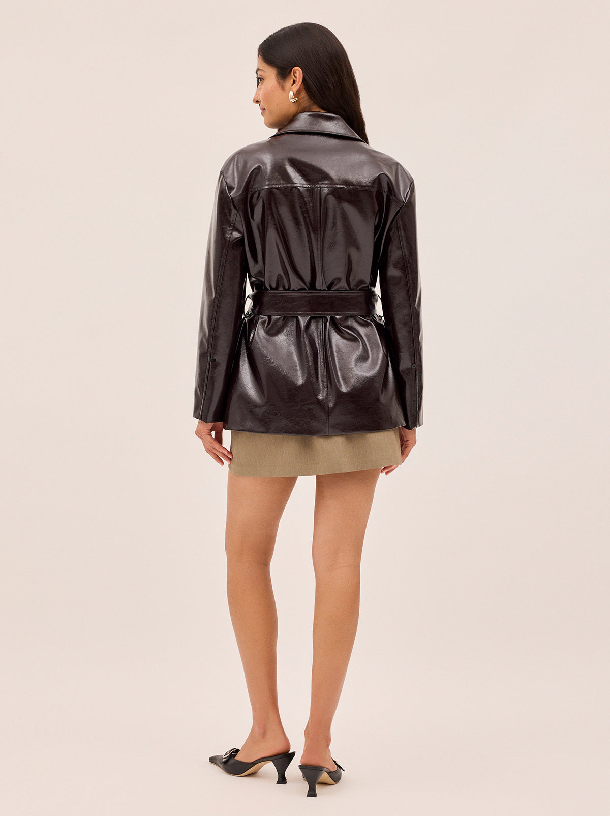 Sophie Dark Chocolate Vinyl Jacket by Kitri Studio. <span style="font-family: -apple-system, BlinkMacSystemFont, 'San Francisco', 'Segoe UI', Roboto, 'Helvetica Neue', sans-serif; font-size: 0. 875rem;">THE jacket of the season, Sophie is crafted from premium chocolate brown vinyl with a subtle sheen and an intentionally oversized, safari-inspired silhouette. Collared neckline. Long sleeves. Button front. Main: 100% PU, Faux-Fur: 100% Polyester.