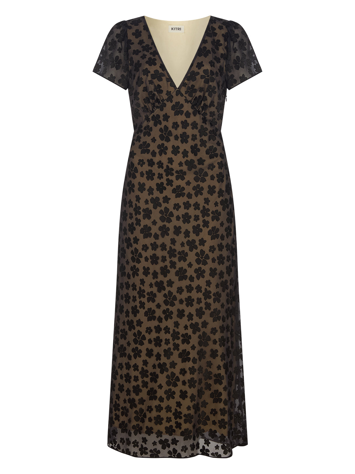 Talia Black Floral Dress by Kitri Studio. Talia Black Floral Dress is a midi-length style crafted from our in-house designed black floral satin burnout.  Bias-cut for a fluid, flattering drape, it’s fully lined in yellow-gold satin that brings subtle warmth and depth to the dark floral design. V-neck. Short sleeves. Concealed side-zip. 75% Viscose, 25% Nylon.