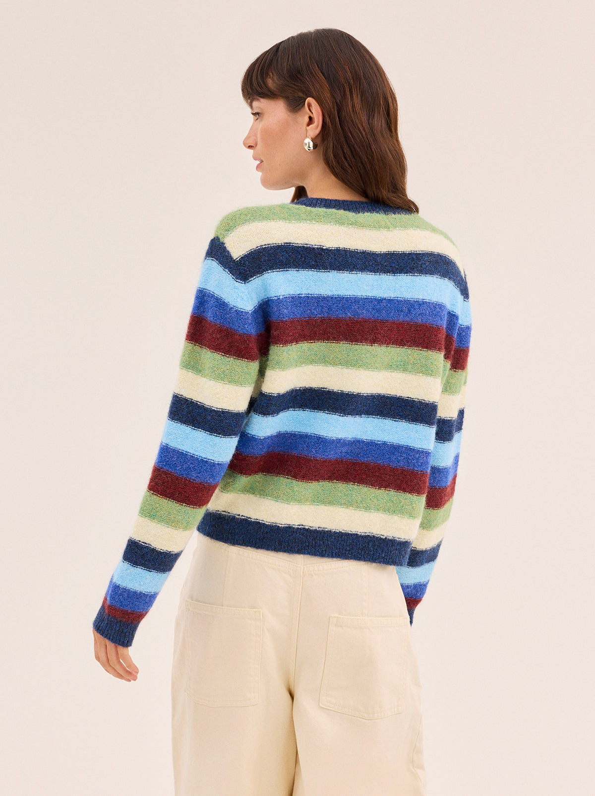 Terri Multi Striped Knit Cardigan by Kitri Studio. A modern take on a wardrobe classic.  The Terri cardigan is crafted from a soft knit yarn in playful stripes adding depth to an everyday layer. Round neck. Long sleeves. Ribbed cuffs. 59% Recycled Polyester, 21% Nylon, 11% Polyester, 8% Wool, 1% Elastane.