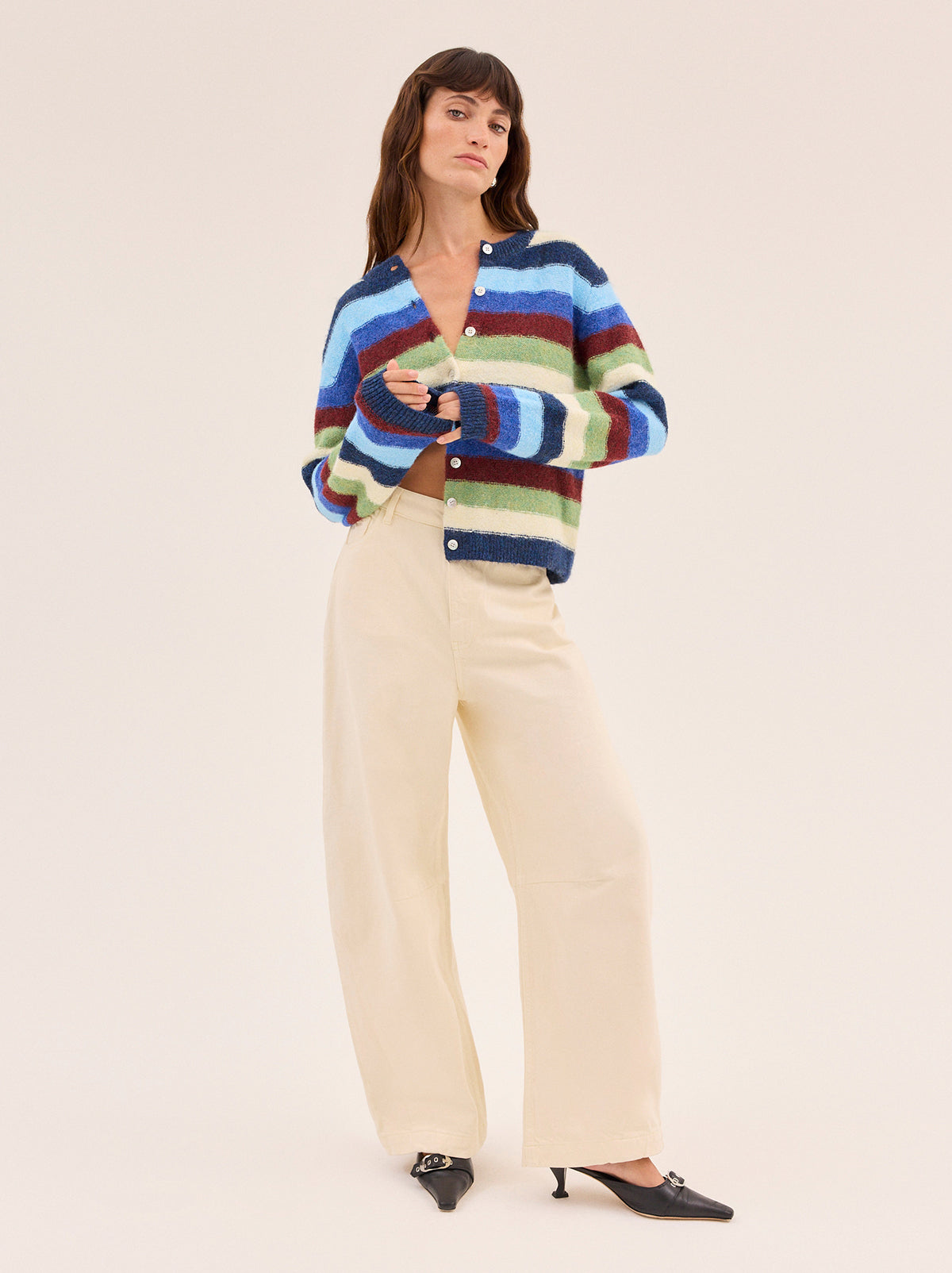 Terri Multi Striped Knit Cardigan by Kitri Studio. A modern take on a wardrobe classic.  The Terri cardigan is crafted from a soft knit yarn in playful stripes adding depth to an everyday layer. Round neck. Long sleeves. Ribbed cuffs. 59% Recycled Polyester, 21% Nylon, 11% Polyester, 8% Wool, 1% Elastane.