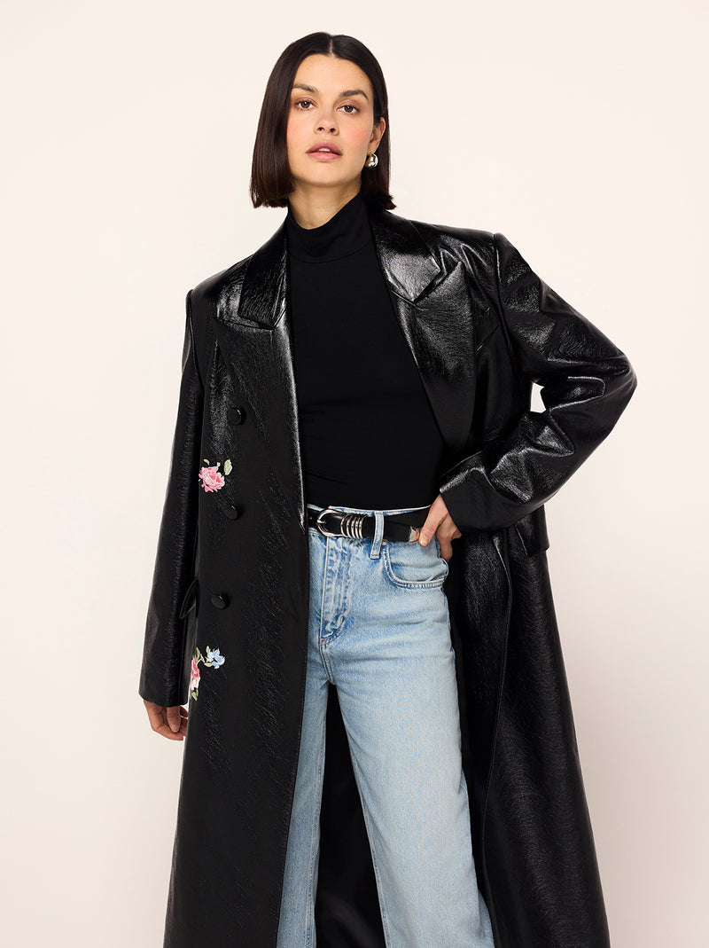 Brogan Oversized Black Embroidered Vinyl Coat - Brogan is an oversized, double-breasted coat in high-shine vinyl with an '80s-inspired statement shoulder and peaked lapel. Her bold silhouette is tempered by a tonal placement floral embroidery. Wear with co-ordinating Carolyn Black Embroidered Vinyl Mini Dress for the ultimate co-ord.