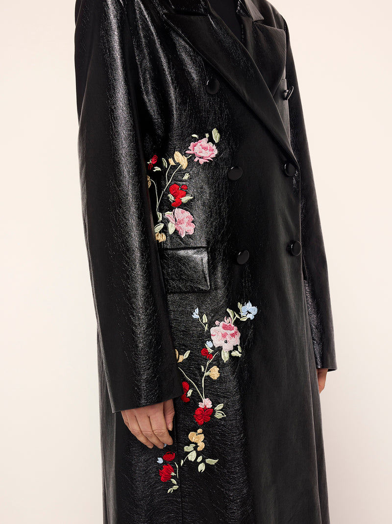 Brogan Oversized Black Embroidered Vinyl Coat - Brogan is an oversized, double-breasted coat in high-shine vinyl with an '80s-inspired statement shoulder and peaked lapel. Her bold silhouette is tempered by a tonal placement floral embroidery. Wear with co-ordinating Carolyn Black Embroidered Vinyl Mini Dress for the ultimate co-ord.