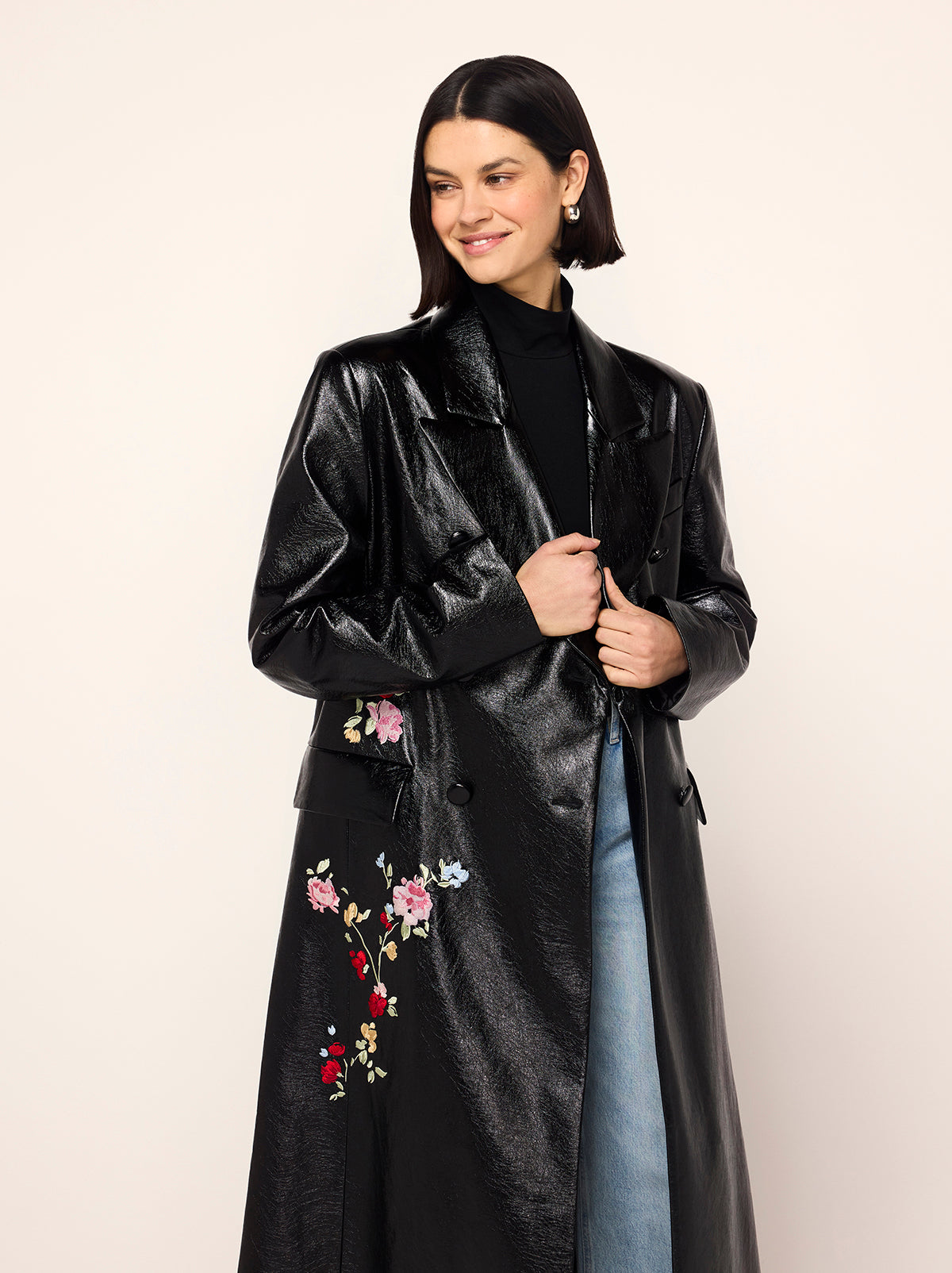 Brogan Oversized Black Embroidered Vinyl Coat - Brogan is an oversized, double-breasted coat in high-shine vinyl with an '80s-inspired statement shoulder and peaked lapel. Her bold silhouette is tempered by a tonal placement floral embroidery. Wear with co-ordinating Carolyn Black Embroidered Vinyl Mini Dress for the ultimate co-ord.