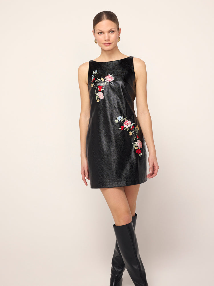 Carolyn Black Embroidered Vinyl Mini Dress - Carolyn is a '90s-inspired mini shift dress that skims the body. Her slash neck means she's bra-friendly too. Wear with co-ordinating Brogan Oversized Black Embroidered Vinyl Coat for the ultimate co-ord.