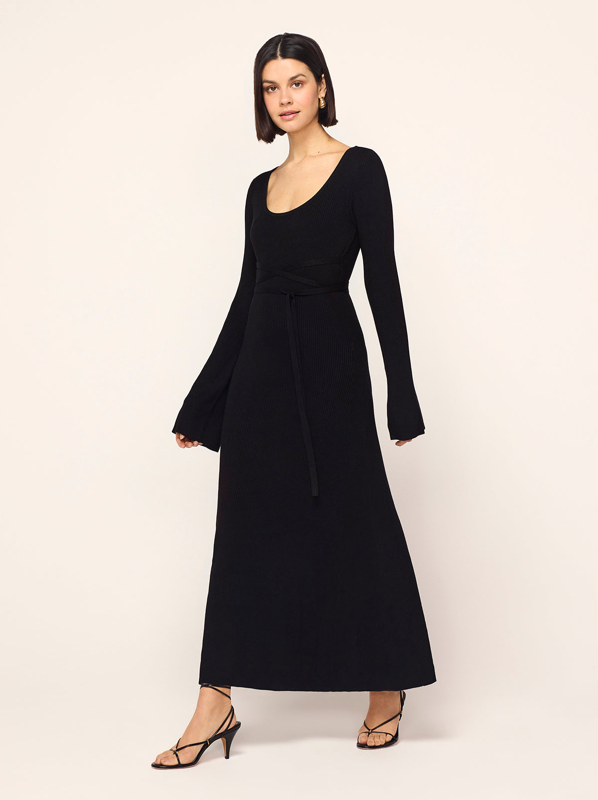 Darryl Black Ribbed Knit Dress - Darryl is a black ribbed knit midi dress with a flattering scoop neckline and feminine flare sleeves. Her ballet-inspired wrap-around tie waist detail flatters the silhouette. She'll look great with your favourite knee high boots.