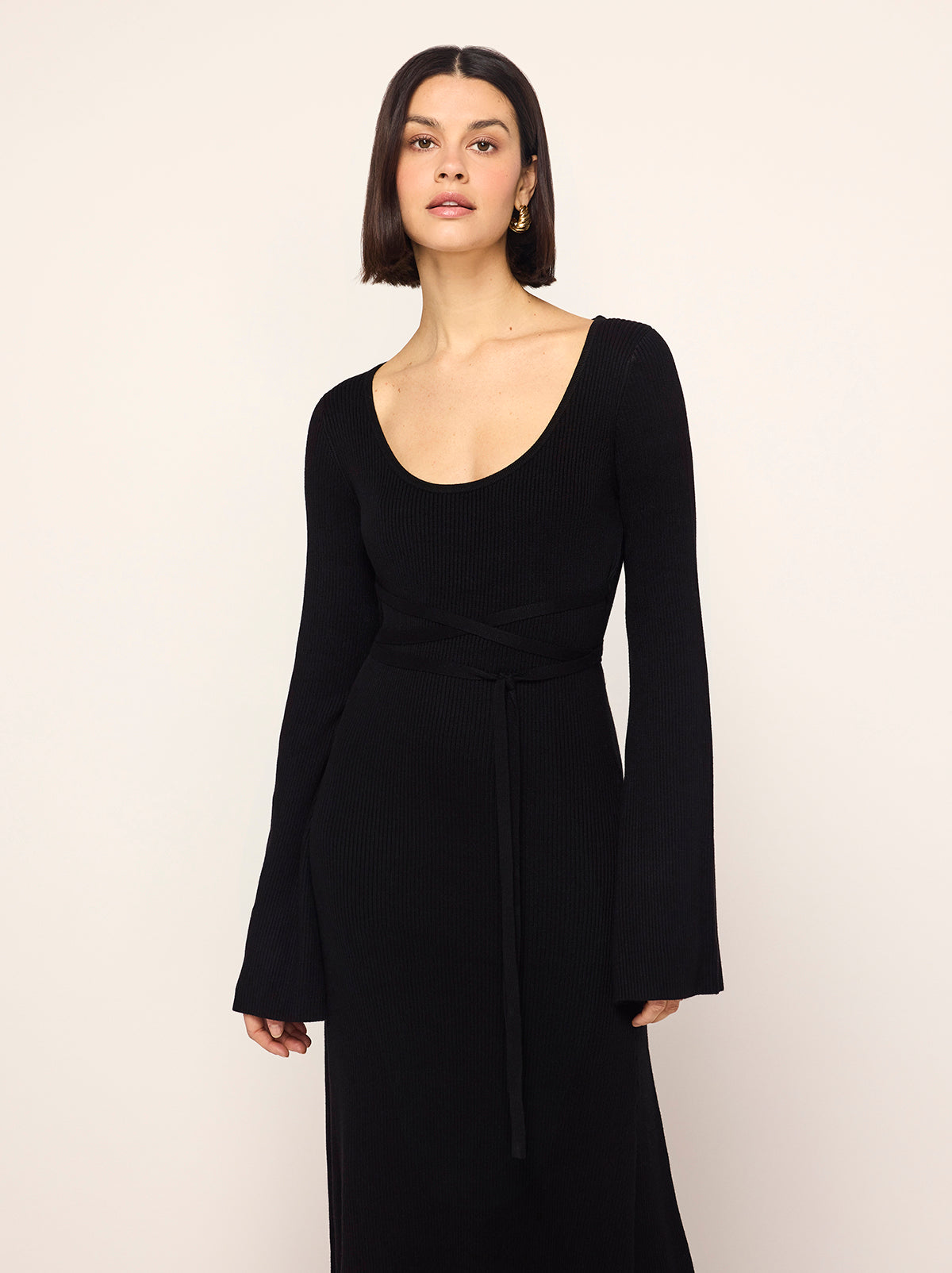 Darryl Black Ribbed Knit Dress - Darryl is a black ribbed knit midi dress with a flattering scoop neckline and feminine flare sleeves. Her ballet-inspired wrap-around tie waist detail flatters the silhouette. She'll look great with your favourite knee high boots.